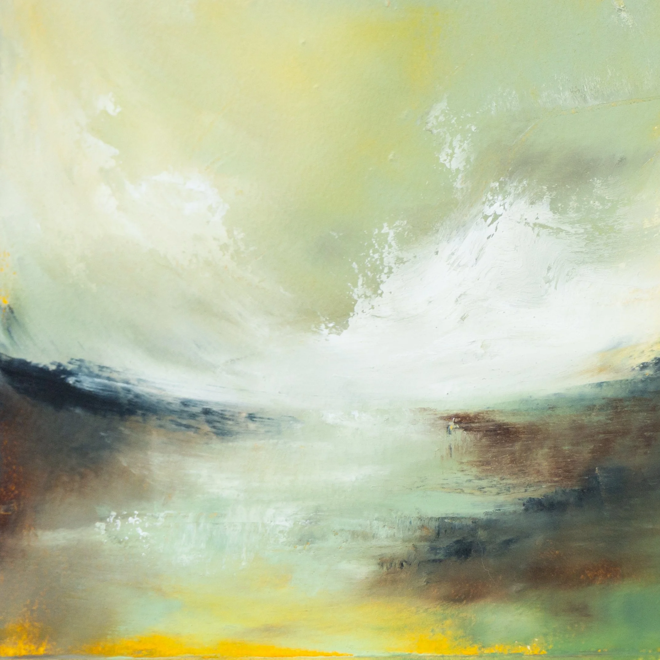 A cool-toned landscape with mist settling over rolling land, the sky streaked with pale light and shifting cloud.