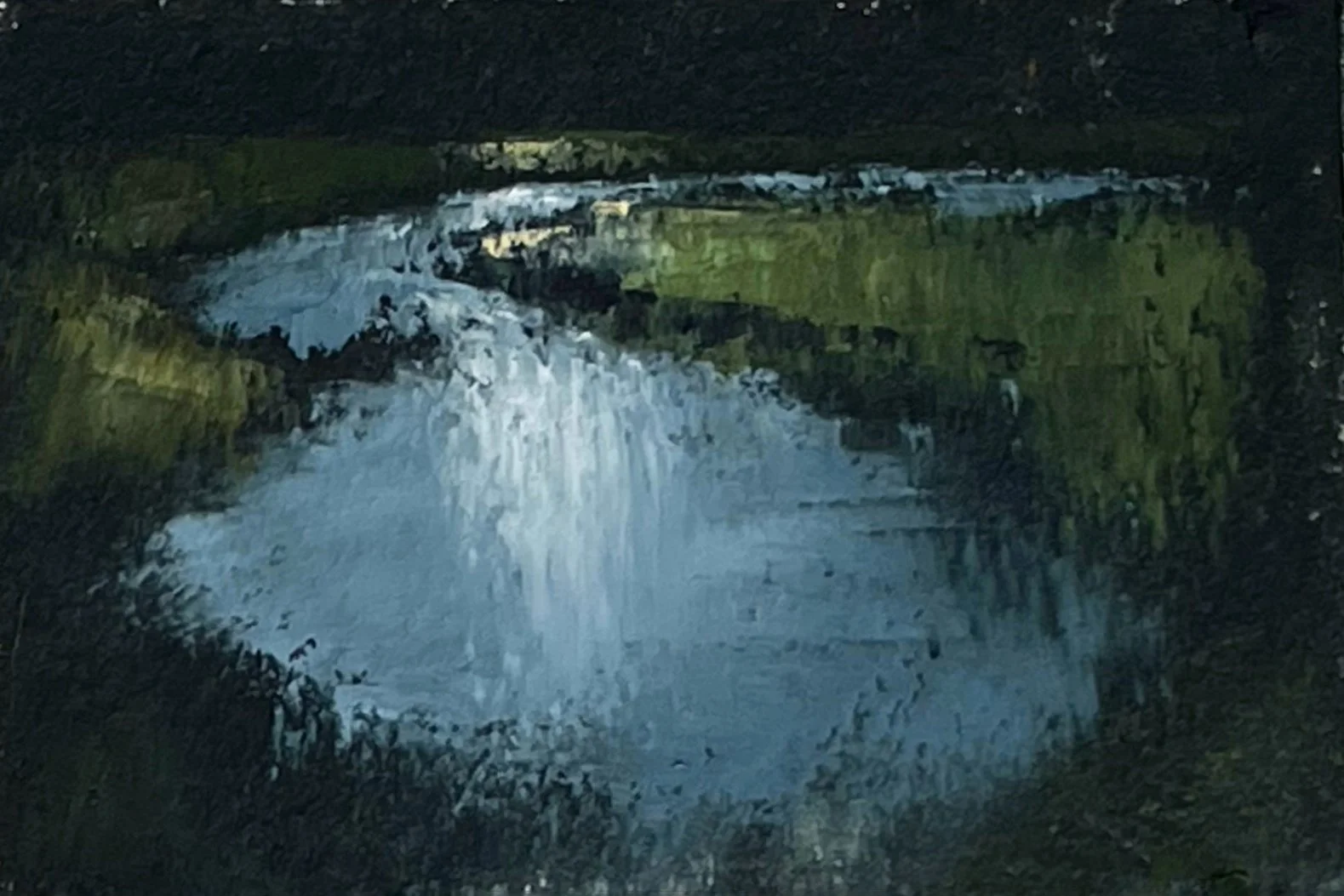 A reflective river winding through varied greens and blues, with bright highlights capturing shifting light on water.