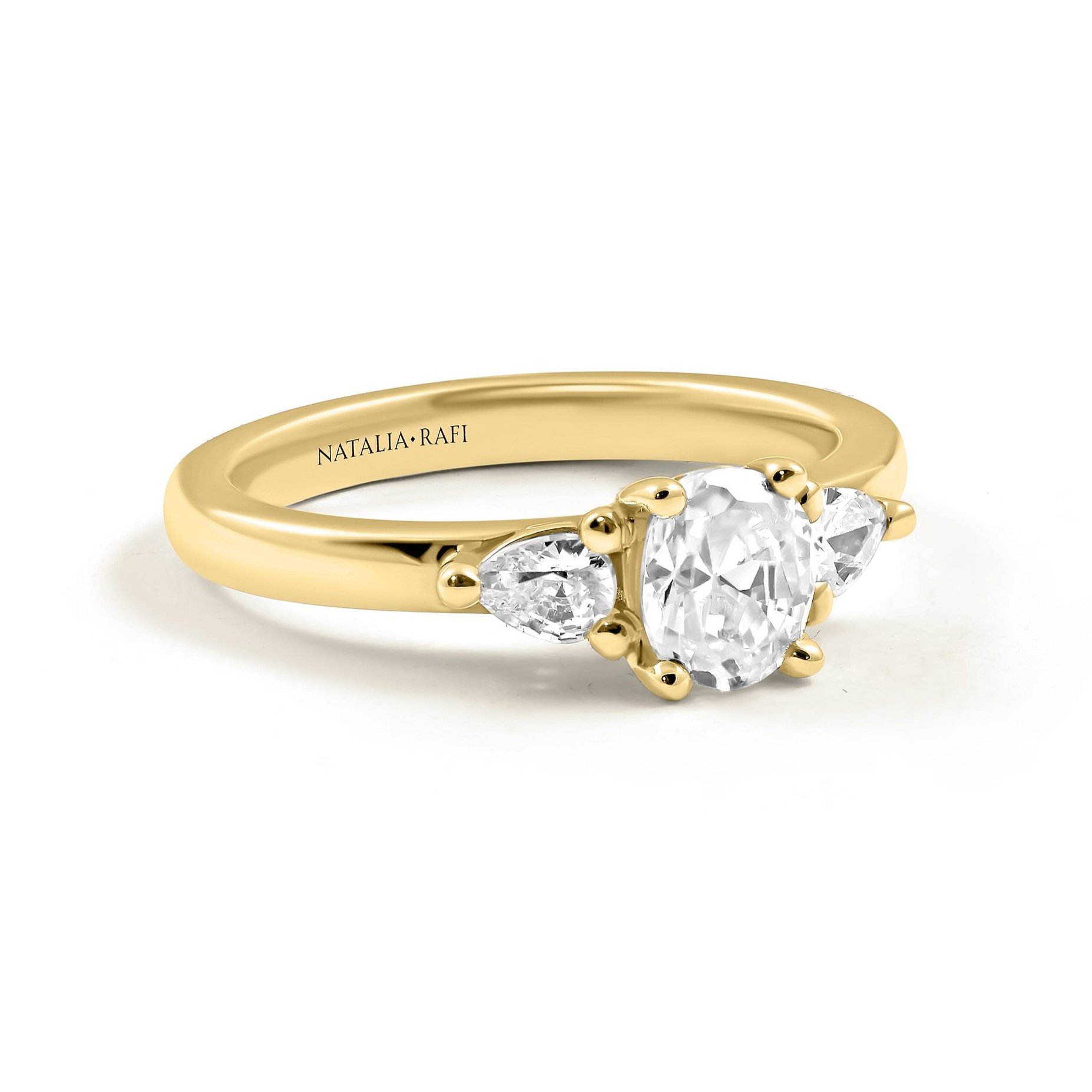 three+stone+oval+and+pear+diamond+engagement+ring+gold+1.jpg