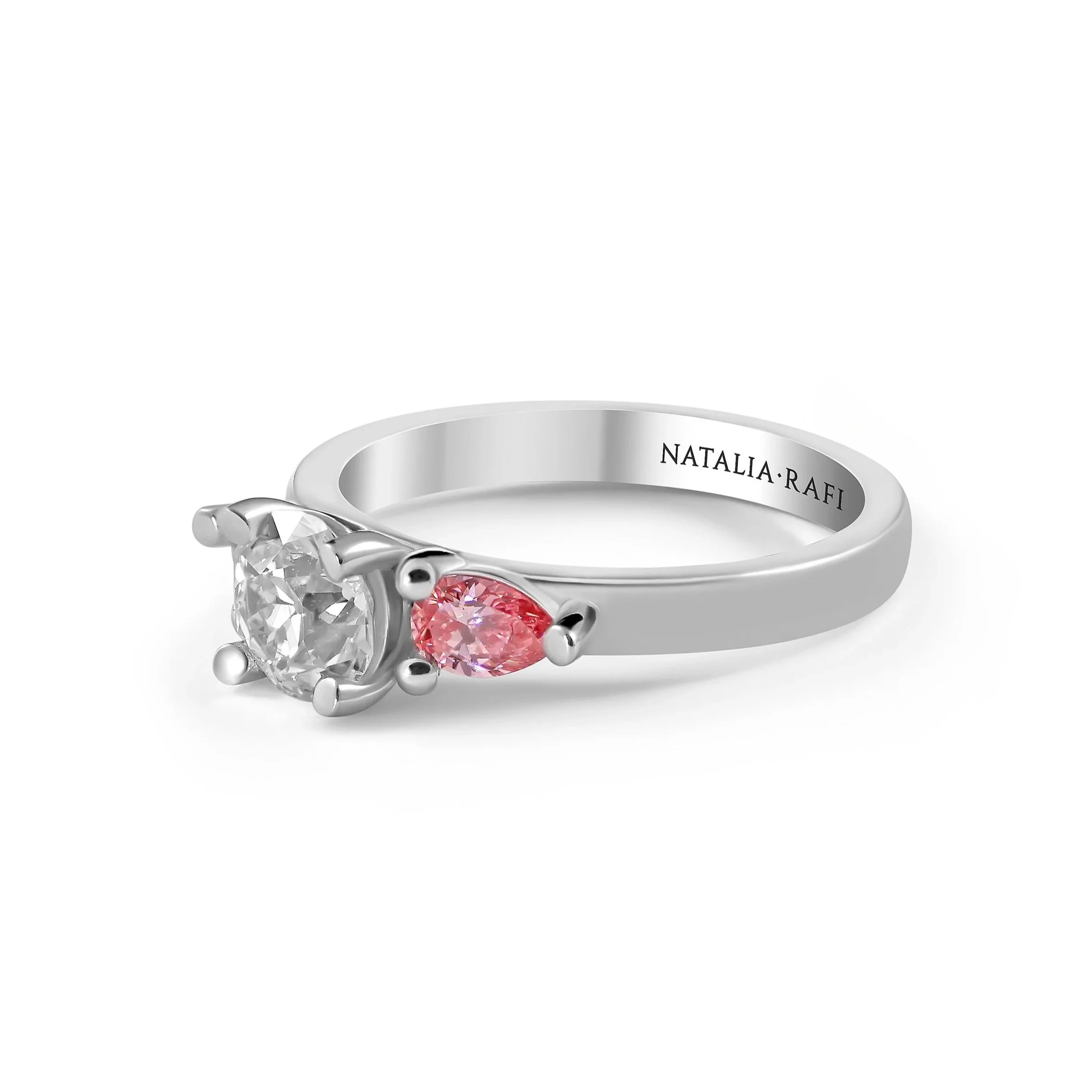 Round+diamond+and+pink+diamond+engagement+ring+side+view.jpg