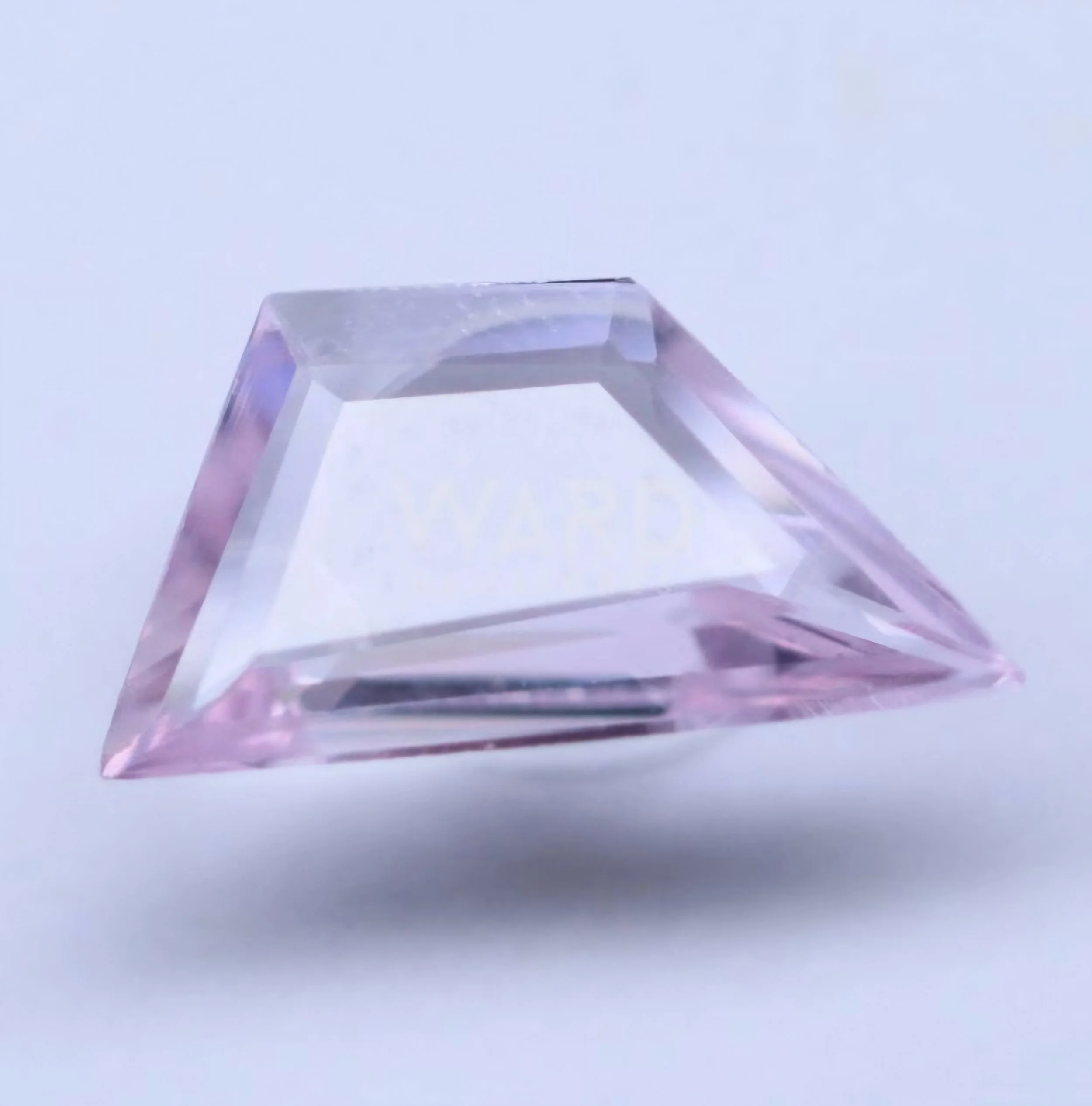 Nice pink colour,  we would need to get the stone cut down to size but would be able to keep the shape and make it a perfect fit.