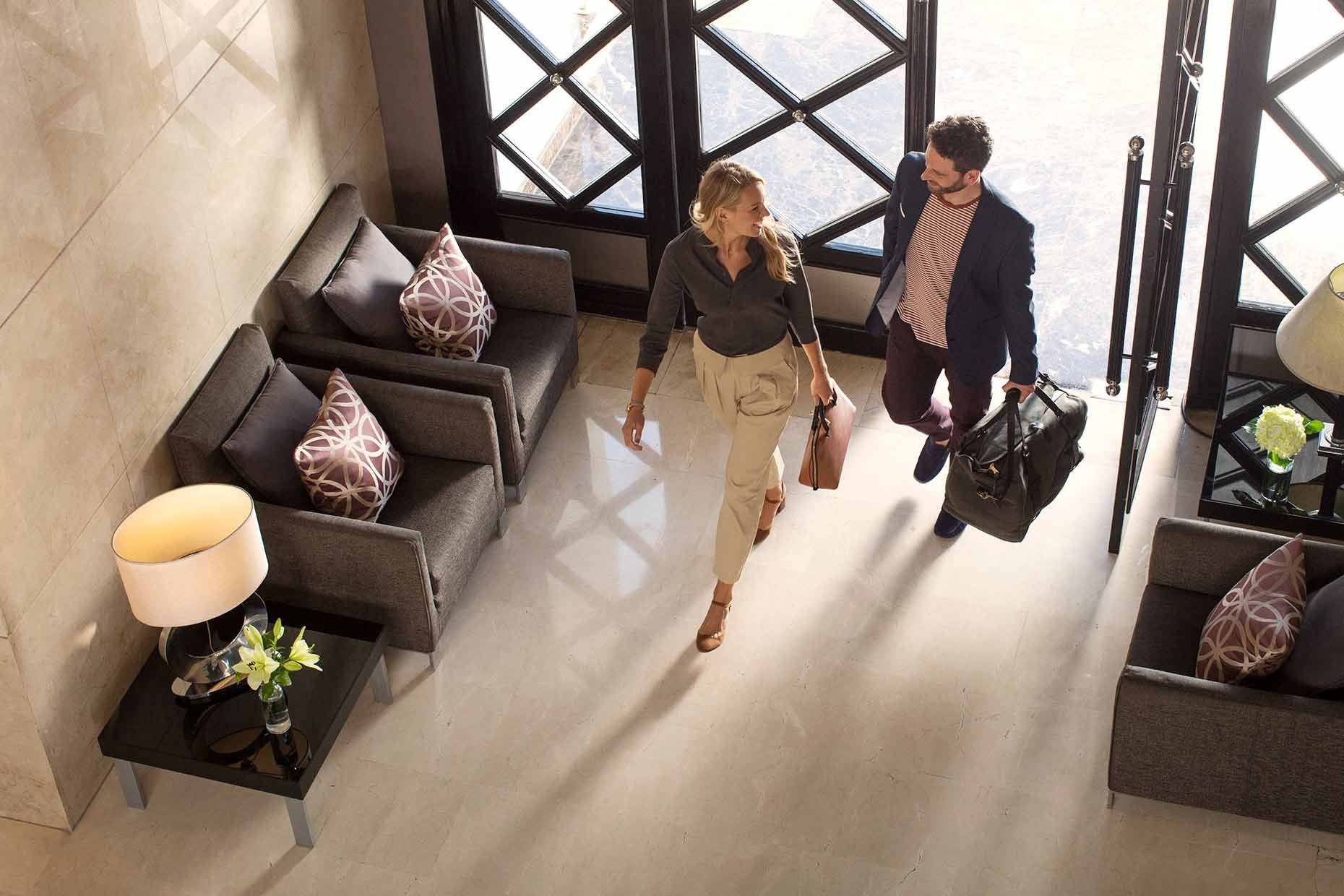 couple-walking-in-to-hotel-lobby.jpg