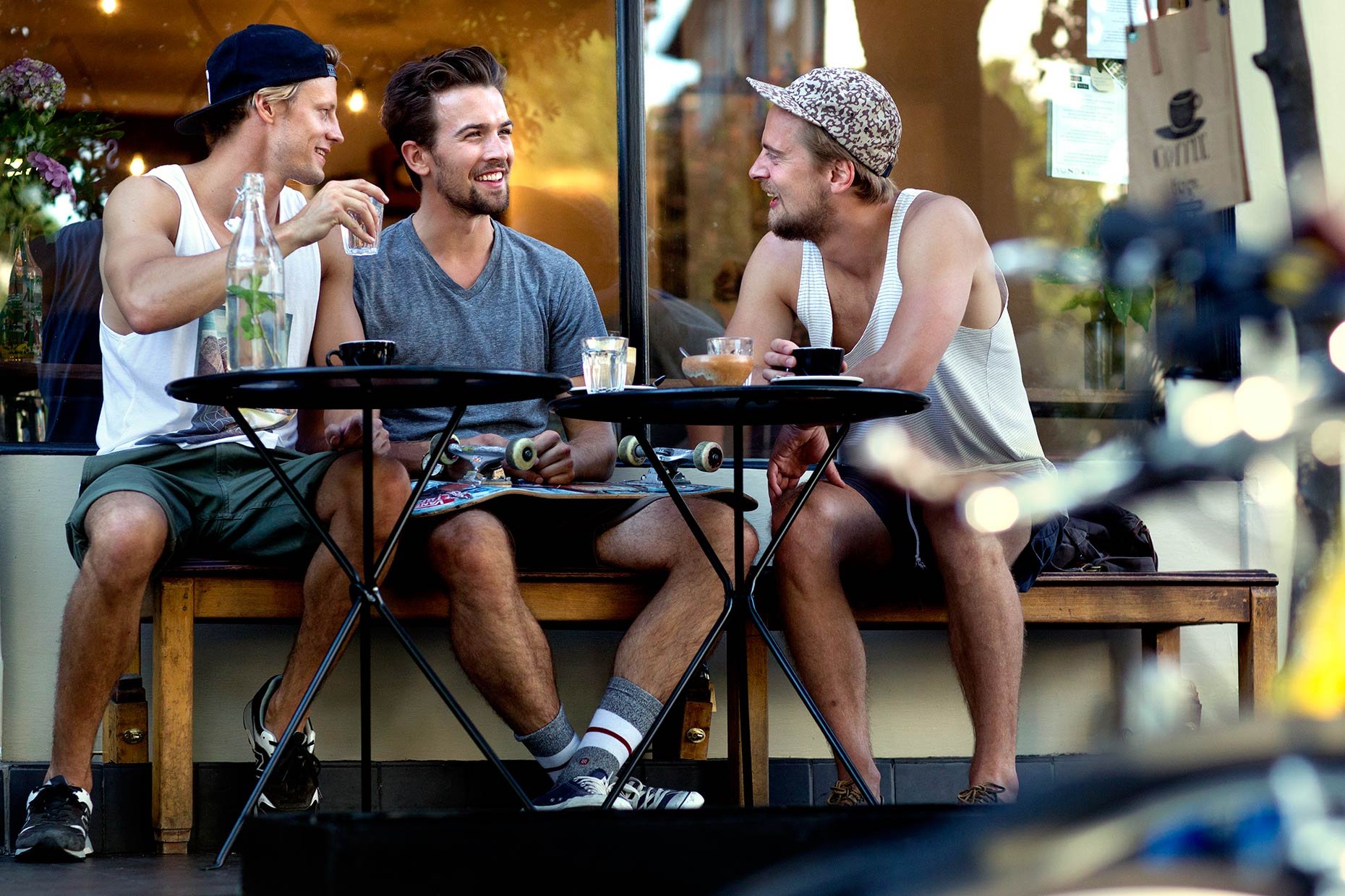 young-men-sitting-outside-cafe.jpg