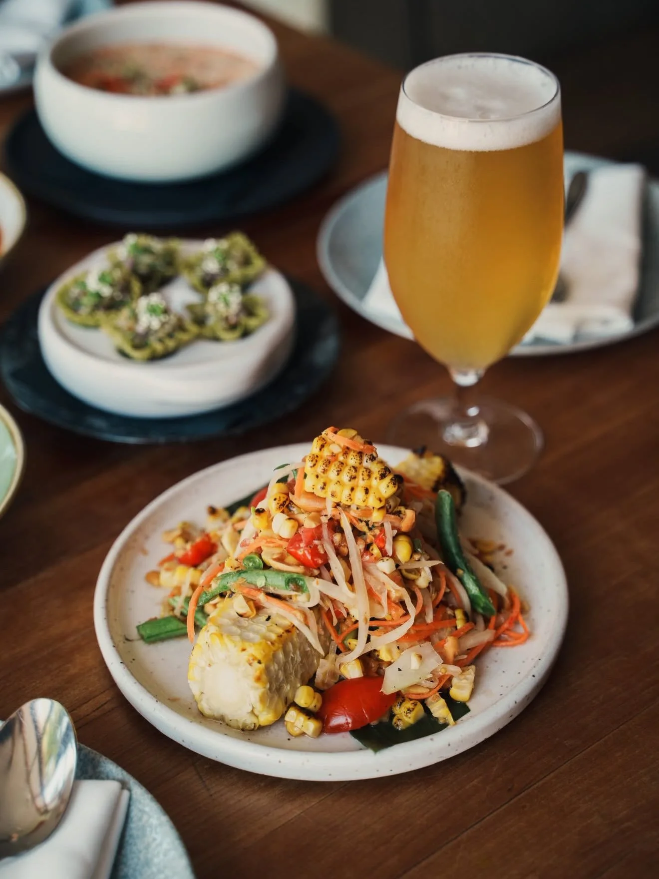 A PEAK SUMMER PAIRING TO PIQUE YOUR INTEREST

The West Coast interpretation of a classic Thai salad, shaped by what&rsquo;s in season from @maenamrestaurant and a frosty Crispy Black Lime Lager collaboration beer from ours truly and Maenam @chefangus