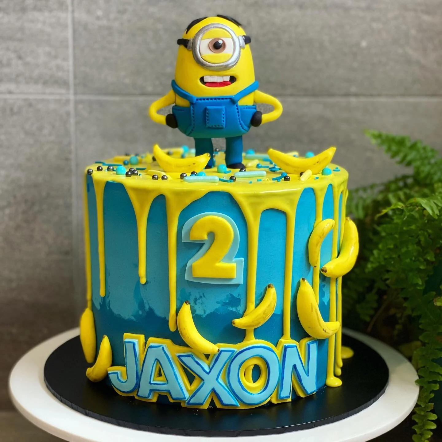 &bull; MINION &bull; 🍌💙
// See previous post for BTS VID! 🎥 
// Happy 2nd Birthday Jaxon!💛💙
// 7&rdquo; Funfetti Buttercake w/ CFD Buttercream, ganache drip and hand made fondant Minion figurine and bananas.
// Sprinkles and Sprinkle Rods from @picnartsugar 
#minioncake #minions #kidscakes #dripcake #cakefordays #melbournecakes #cakesofmelbourne #birthdaycake #cake #cakephotography #cakeoflife #cakegram #cakedecoration #cakedecorator #cakeboss #cakecakecake #cakeporn #cakeoftheday #cakelover #cakelove #cakedesigner #cakesofinstgram #cakestagram #cakedecorating #cakes