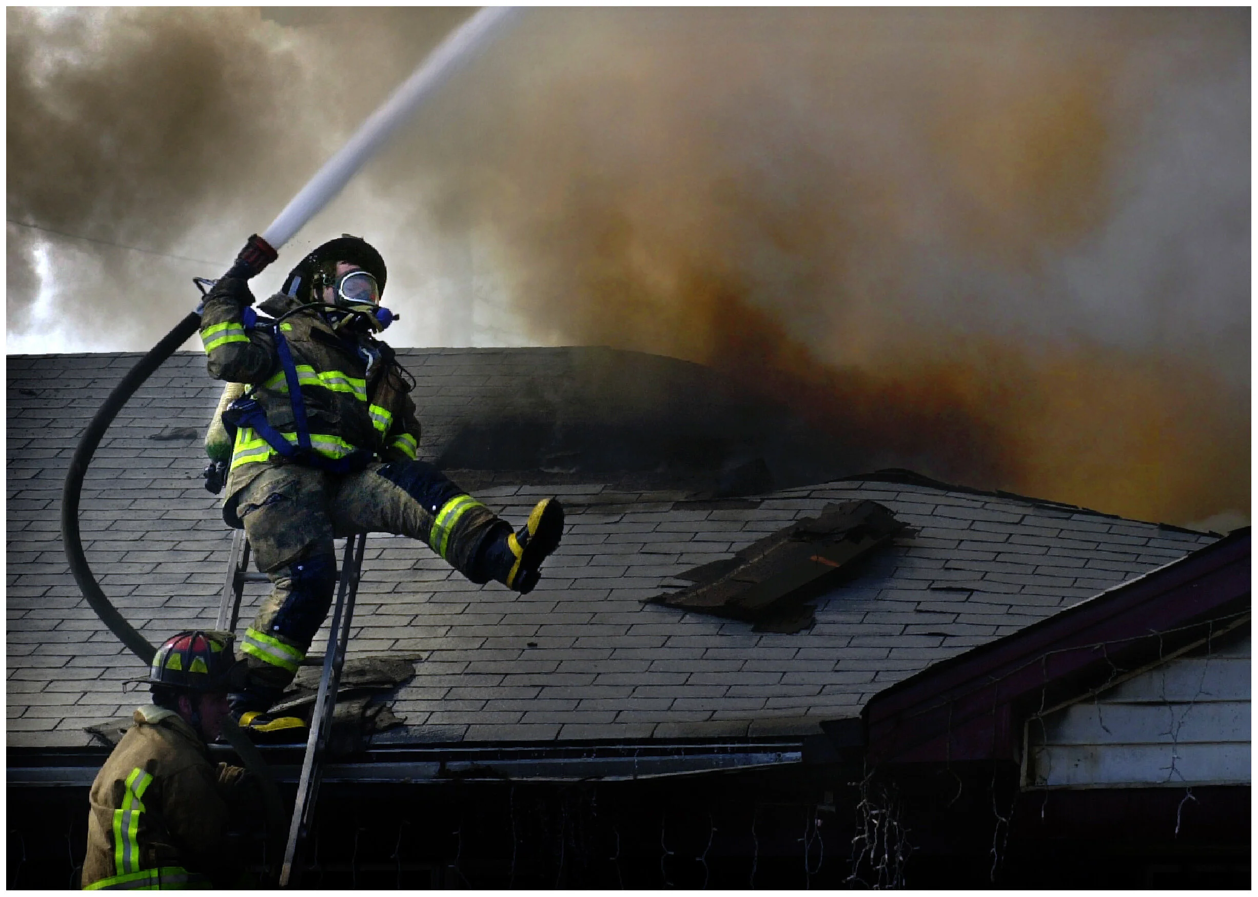  Memphis firefighter Dan Dooley stumbles and loses control of the hose while fighting a blaze on Stormy Street that left a family of nine homeless Thursday afternoon. 