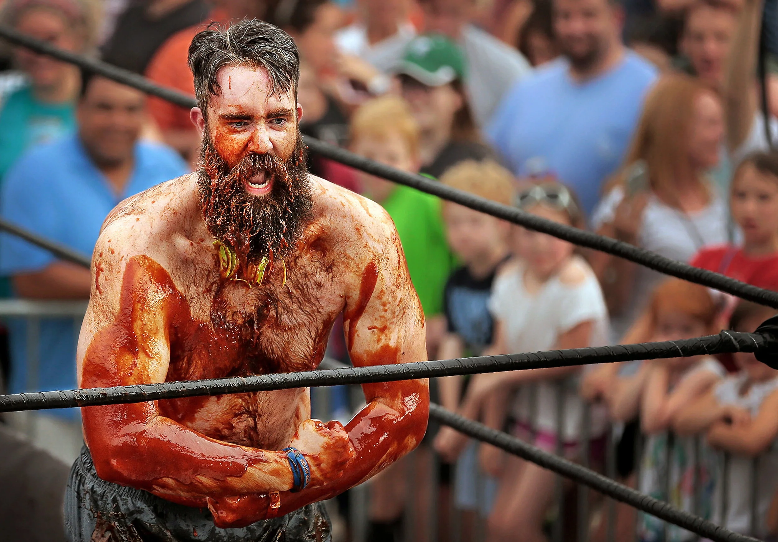  Matt Butler reacts after winning his bout during sauce wrestling at the annual Memphis in May World Championship Barbecue Cooking Contest at Tom Lee Park. 