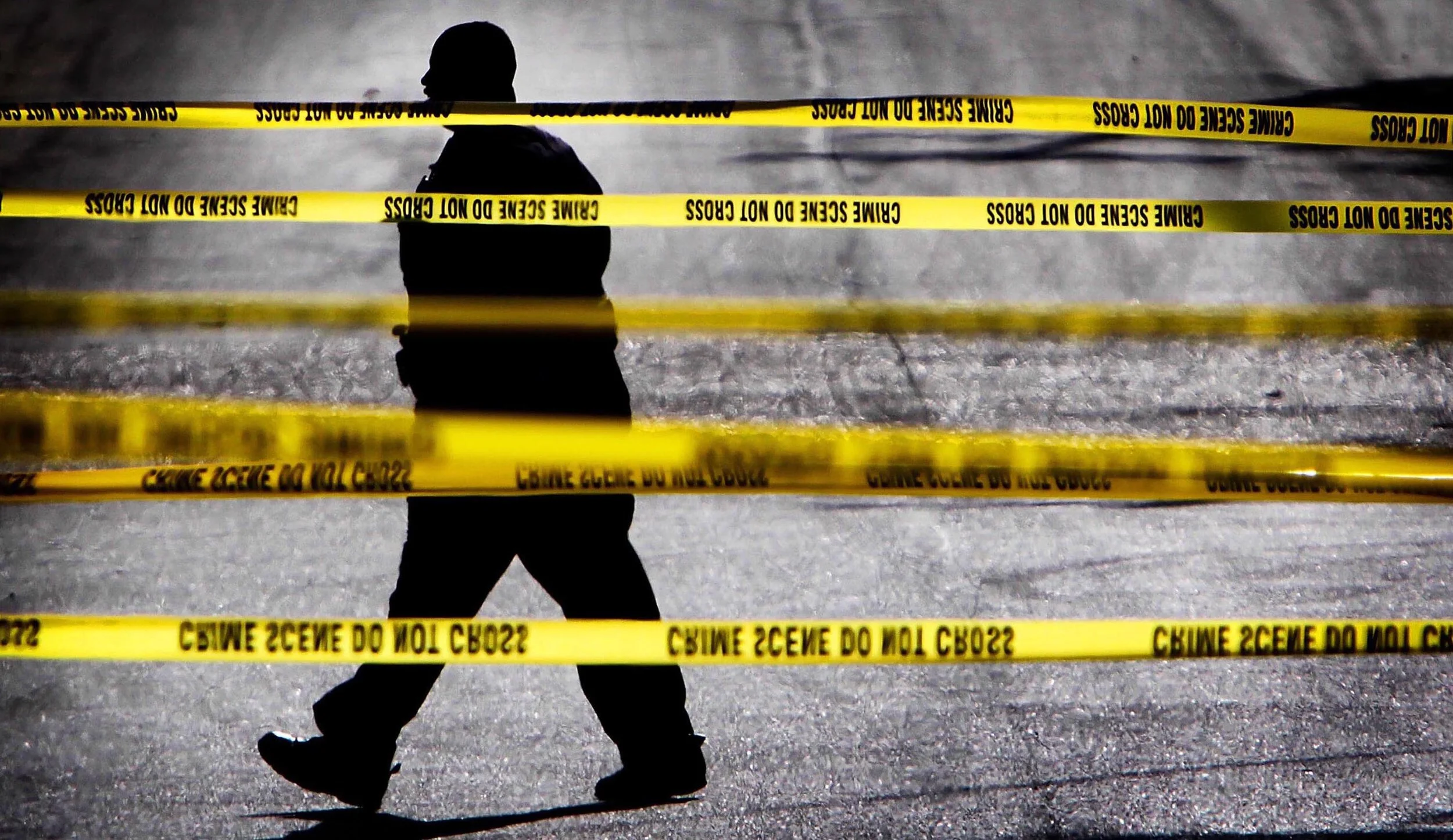  Memphis Police Officer M. Brent crosses the scene of a shootout between Memphis Police Officer Charles Wren and a shotgun-wielding man at the corner of Getwell and Barron Monday afternoon. Wren was rushed to the Med after being shot in the leg. 
