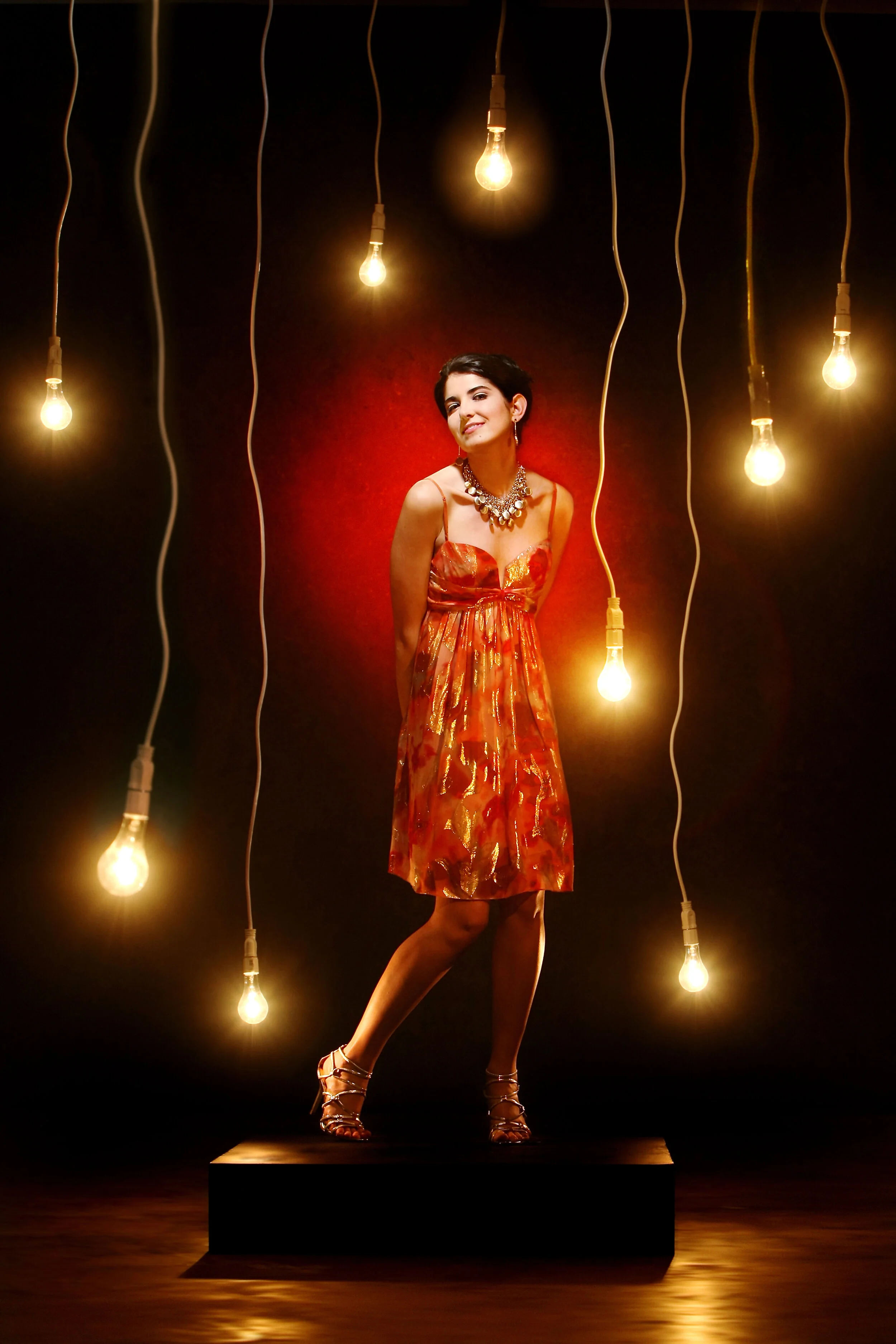  This spring is all about the flirty things like this hot metallic strappy cocktail dress paired with silver pumps. 