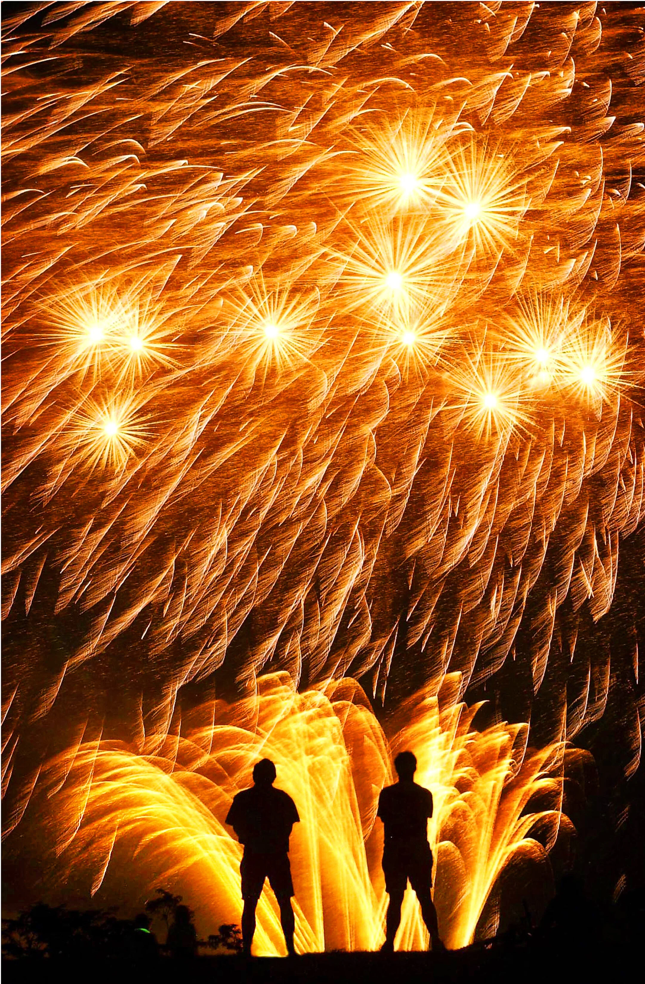  Fireworks light the sky at Shelby Farms at the annual Star Spangled Celebration as an estimated 63,000 people gather to watch the show. 