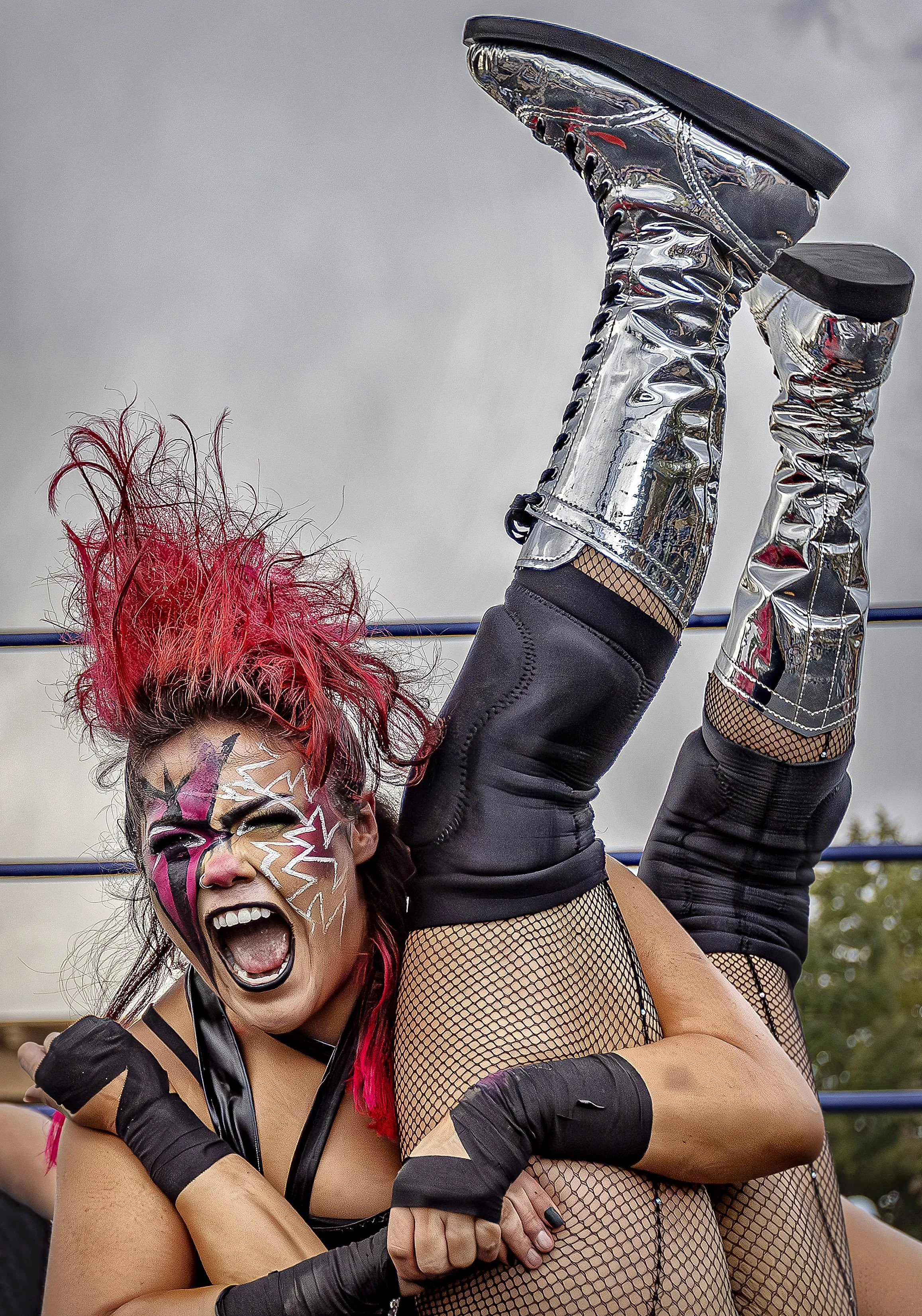  Amiaya Brown playing her evil alter ego "Zamaya" takes down Taylor Paulson with a roar during a live live Lucha Libre event hosted by Duke City Championship Wrestling at the Extravaganza on Museum Hill on Saturday, Sept. 21, 2024 to celebrate Mexica