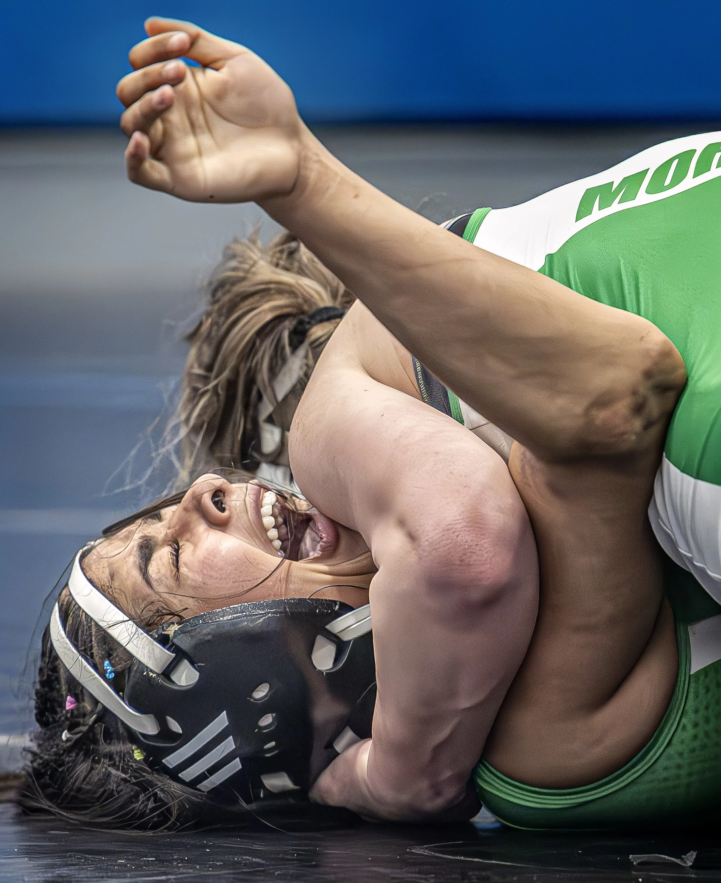  Pojoaque Valley's Mariah Leyba is pinned by Kristina Means from Moriarty after dislocating her elbow during the Region 1 girls wrestling championships at Cleveland High School on Friday, Feb. 6, 2026. Leyba was had been leading the match 5-0 when sh