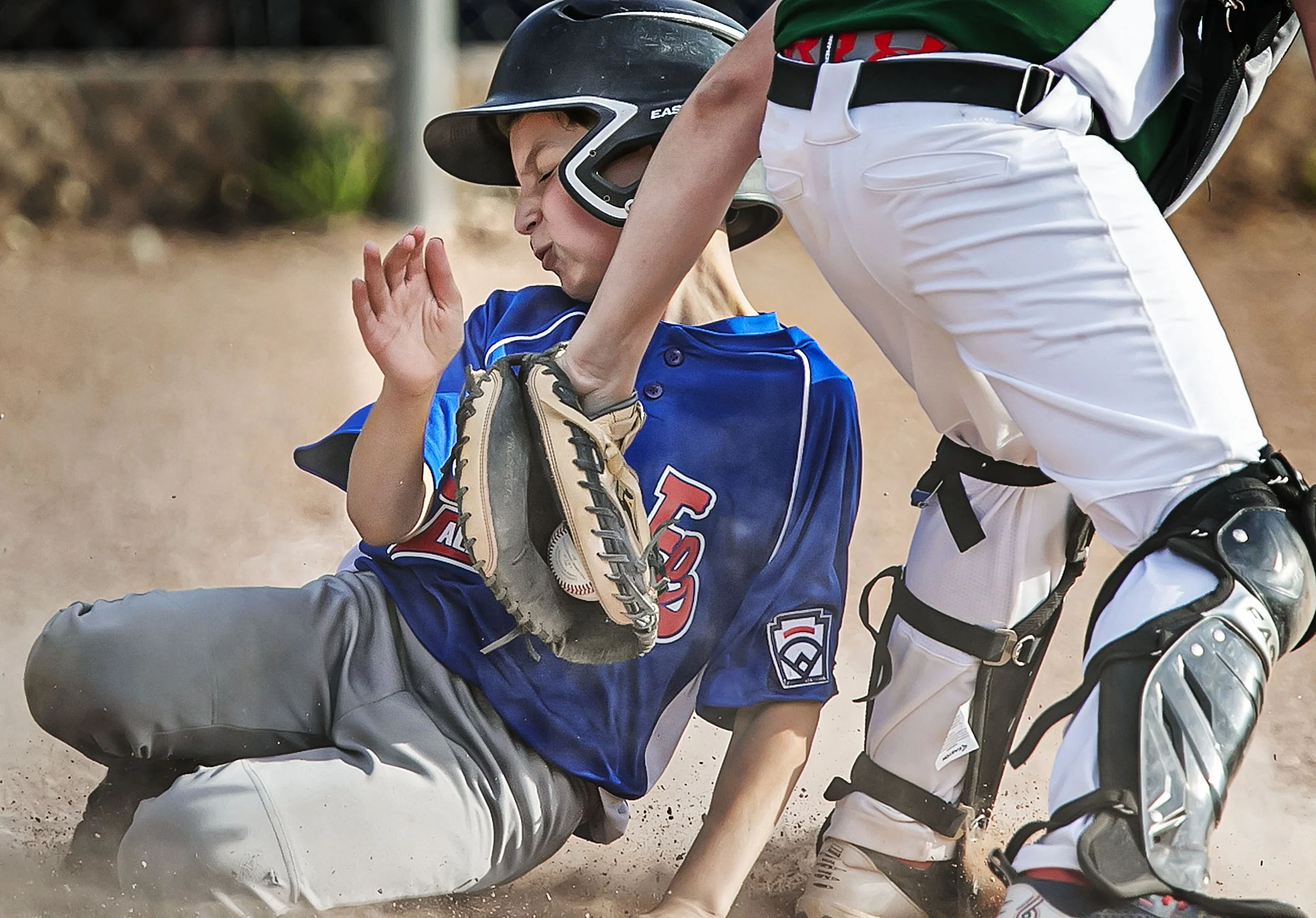  Santa Fe little league's Dominic Wakefield gets tagged out by Los Alamos catcher Sebastian Gonzalez while trying to steal home during the 9-11 District All-Star championship game at Ragle Park on June 30, 2022. 