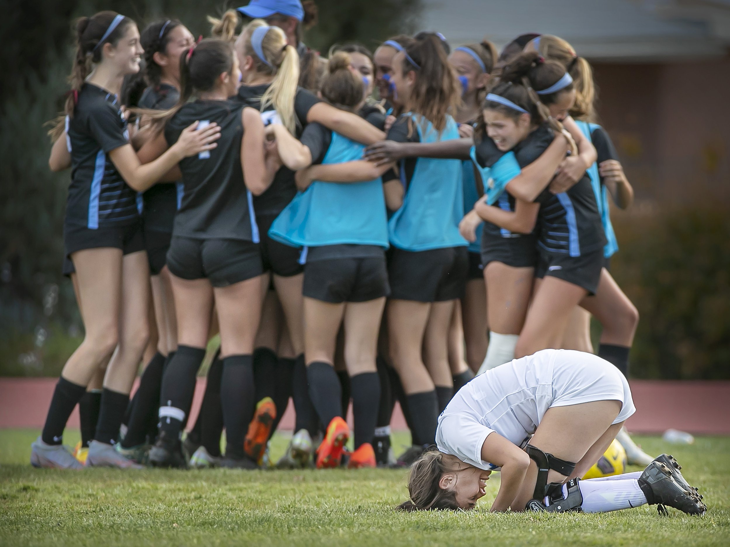  Lady Horsemen midfielder Lauryn Pecos (right) reacts as the  Sundevils celebrate after St. Michael's 2-1 state semifinal loss to Sandia Prep in Albuquerque on Nov. 1, 2022. 