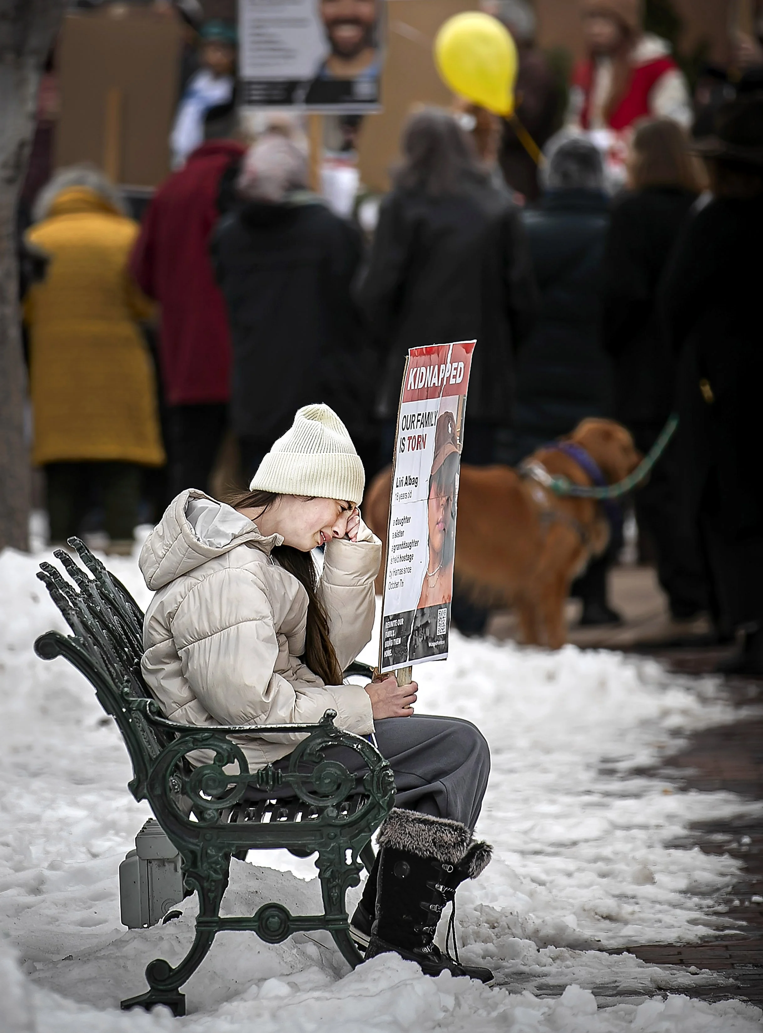 Twelve-year-old Ilana Dahan from Israel steps away from the crowd to cry as members of the Northern New Mexico Jewish community gather on Jan. 14, 2023 in the Santa Fe Plaza to mark 100 days of captivity for over100 hostages still being held by Hama