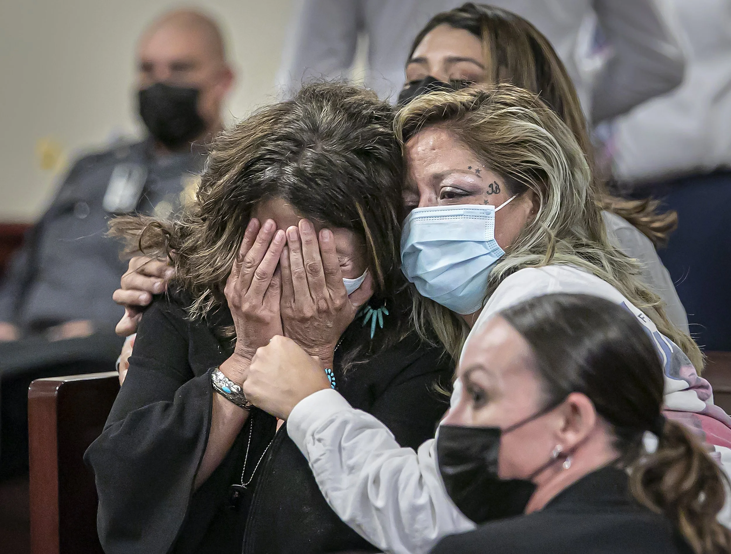  Jude Voss, grandmother of  Fedonta "JB" White is comforted by her daughter Bianca Vega (right) during a sentencing hearing for Estevan Montoya on June 22, 2022  in Judge T. Glenn Ellington' s court for the first-degree murder of White, a former Sant