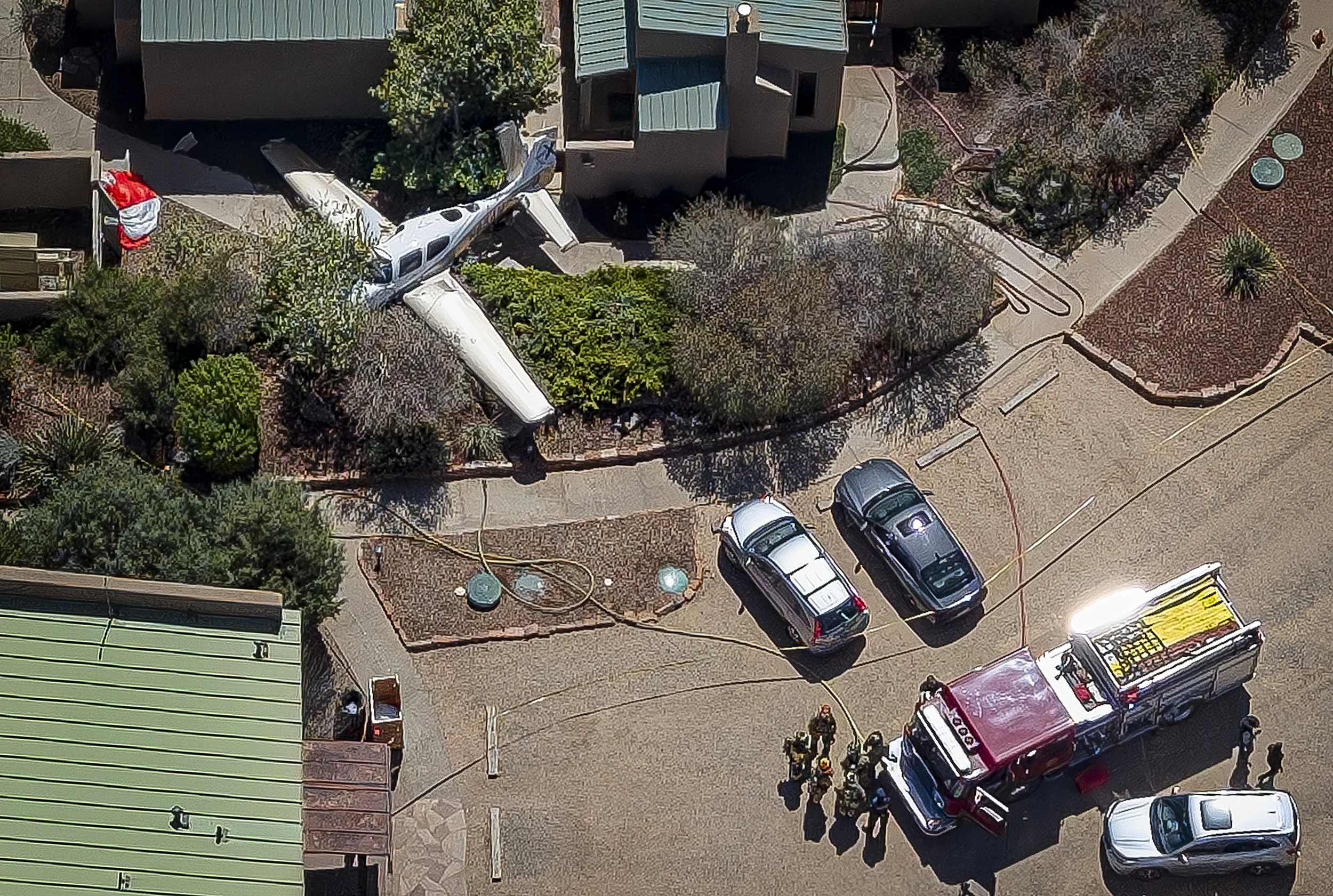  Emergency responders work the scene of a plane crash on Friday, April 17, 2026 at the Ojo Santa Fe Spa Resort in La Cienega. Officials said no injuries were reported in connection with the crash. 
