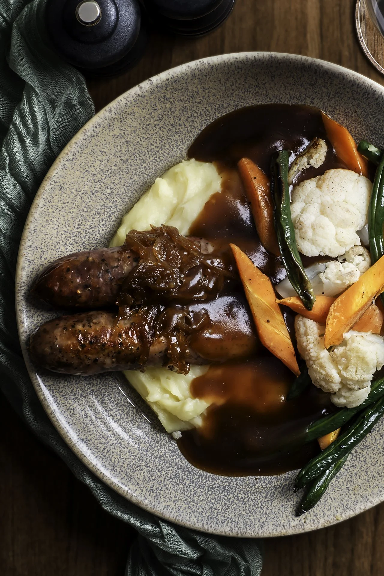 Sausages with mashed potato, gravy and roasted vegetables at The North Star Hotel.
