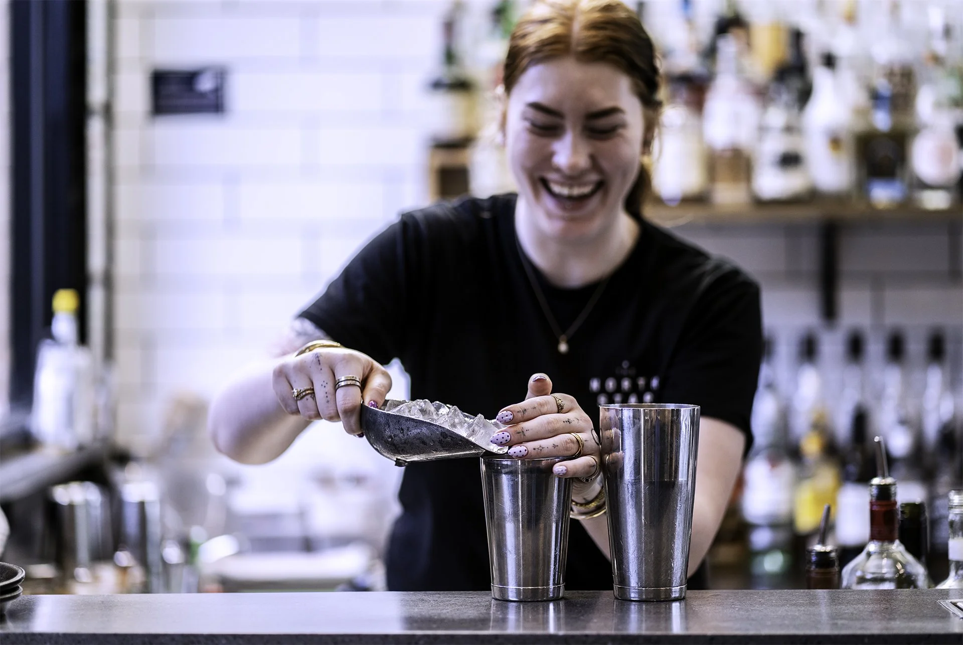 Bartender preparing a cocktail behind the bar at The North Star Hotel in Ballarat.