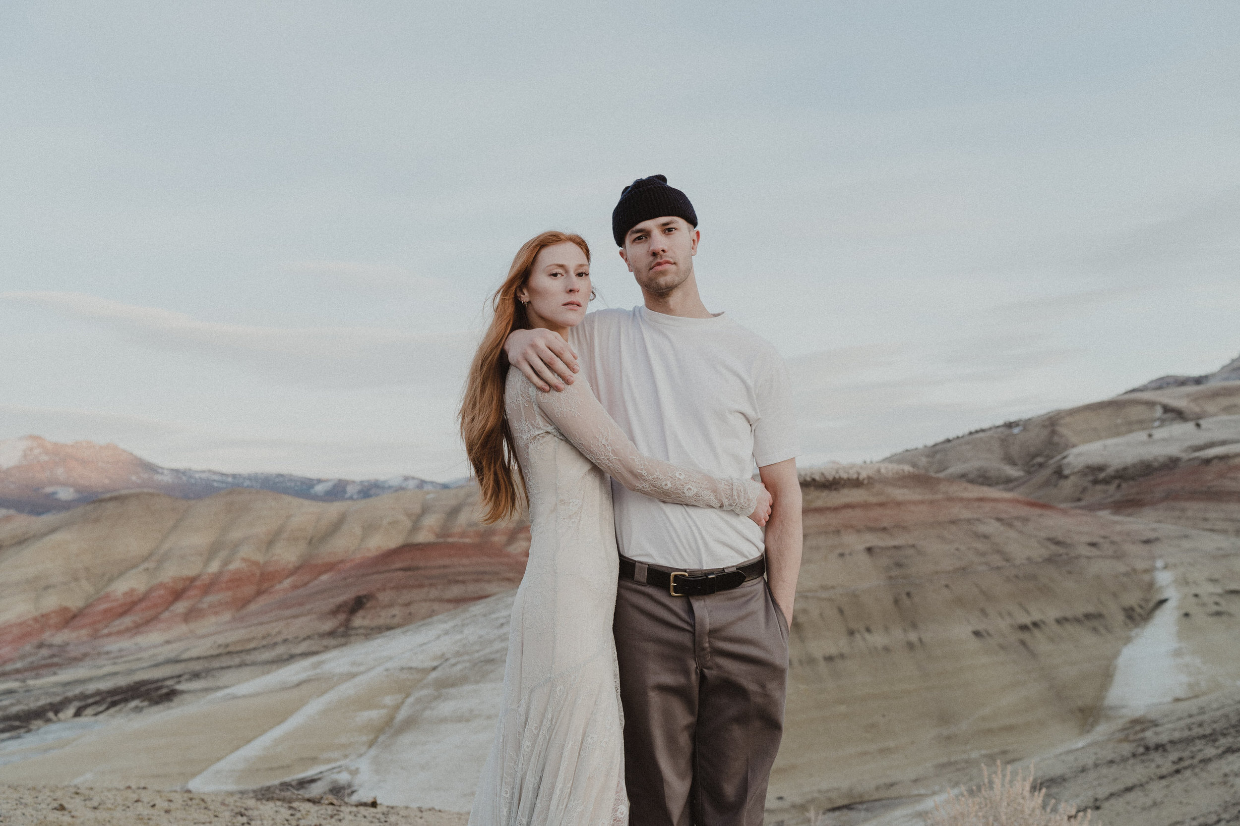 a couple having their enagement photos at the painted hills