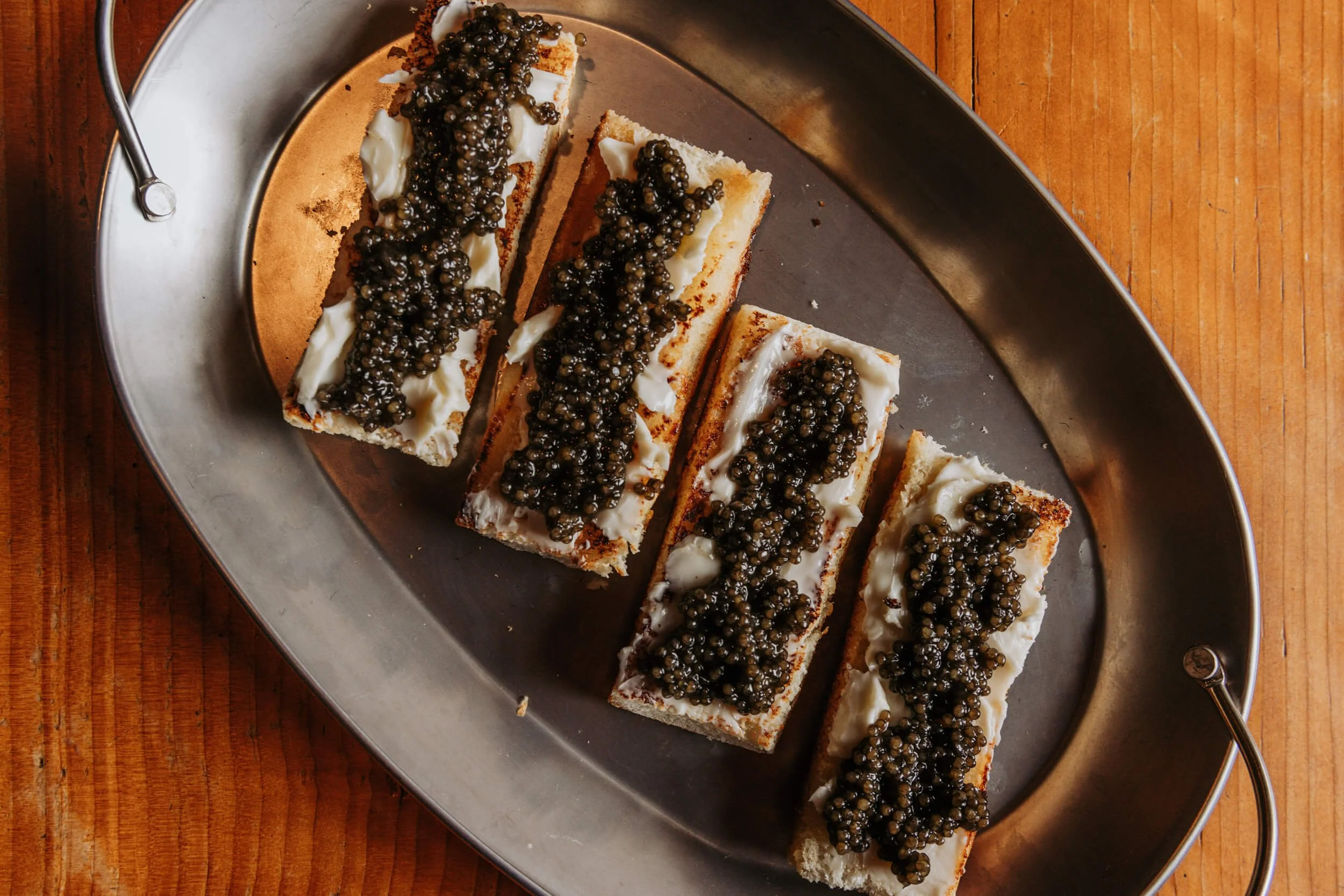 STURGEON CAVIAR on TOASTED BRIOCHE with FRESH BUTTER