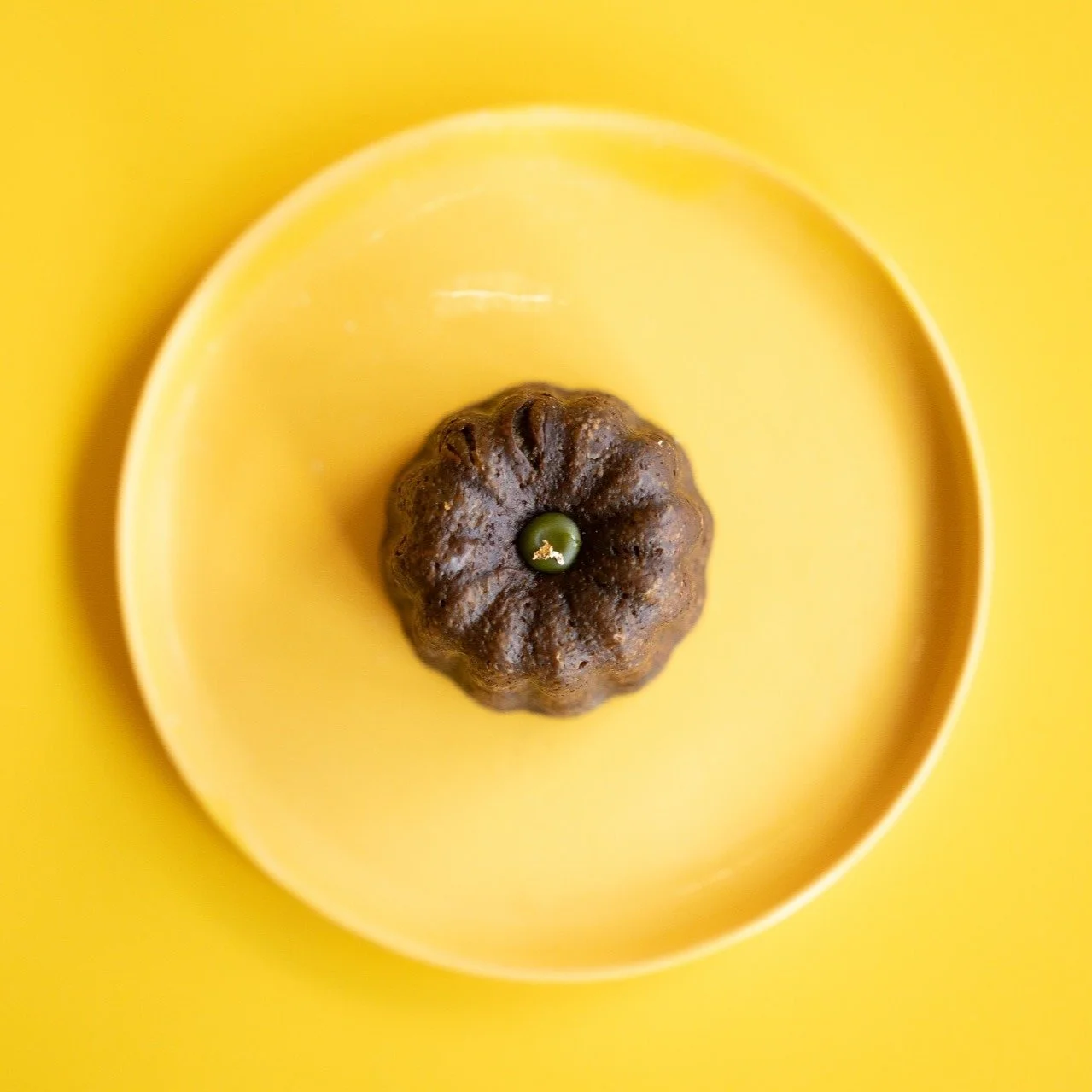 The brief was to match their brand colour. We dyed the bone china an orange-yellow and applied a canary yellow glaze on top. Somehow, we managed to find the right hue&mdash;it felt almost like a miracle. I wasn't sure I'd be able to match it; ceramic