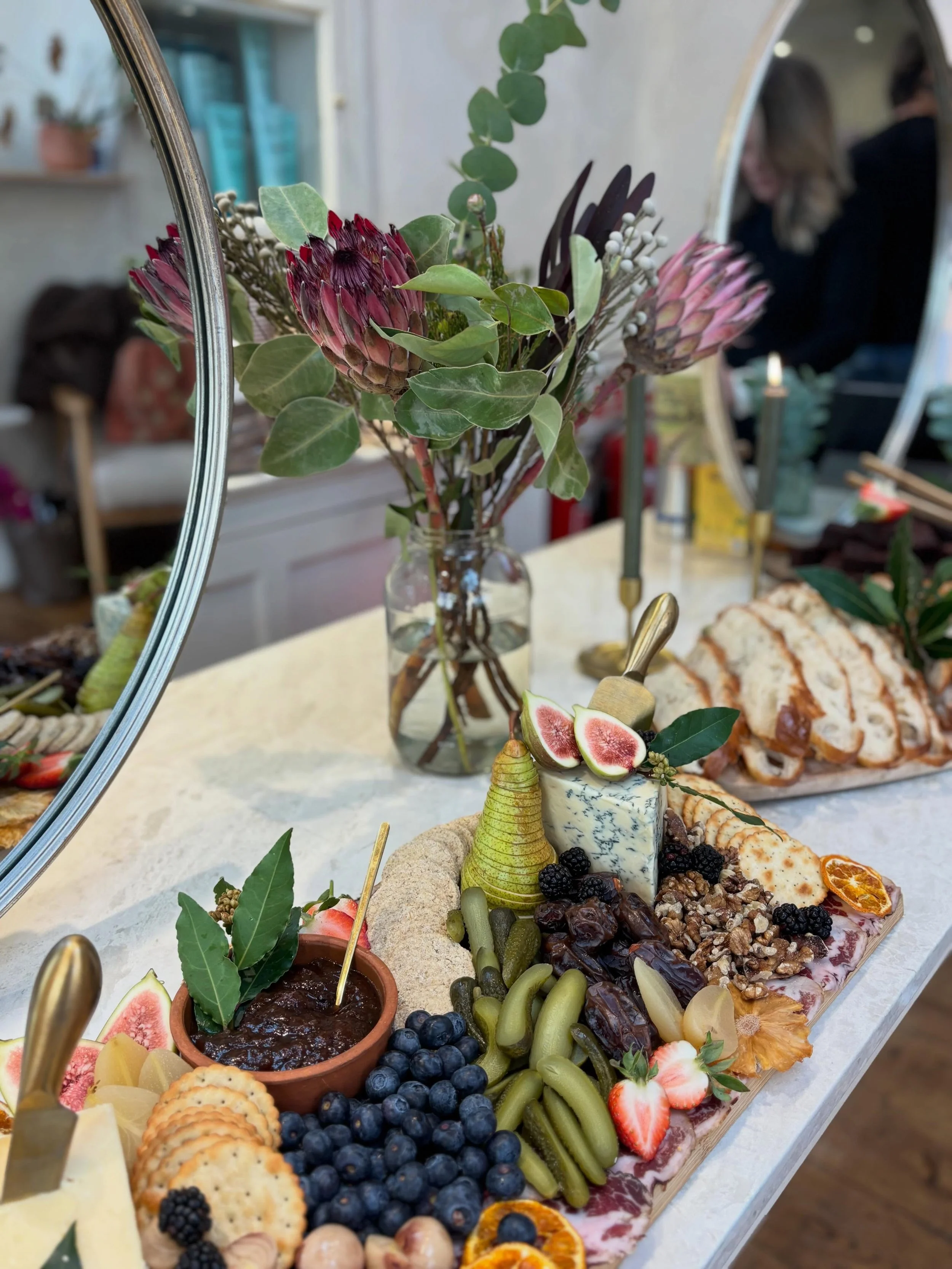 FEAST AND FOLIAGE
&bull;
We style every spread with lush foliage and fresh florals to make the food truly pop 🌿✨ 
&bull;
Creating those little wow moments your guests won&rsquo;t stop talking about 💫 
&bull;
@wild.fig.bath 
&bull;
#grazingtablesbat