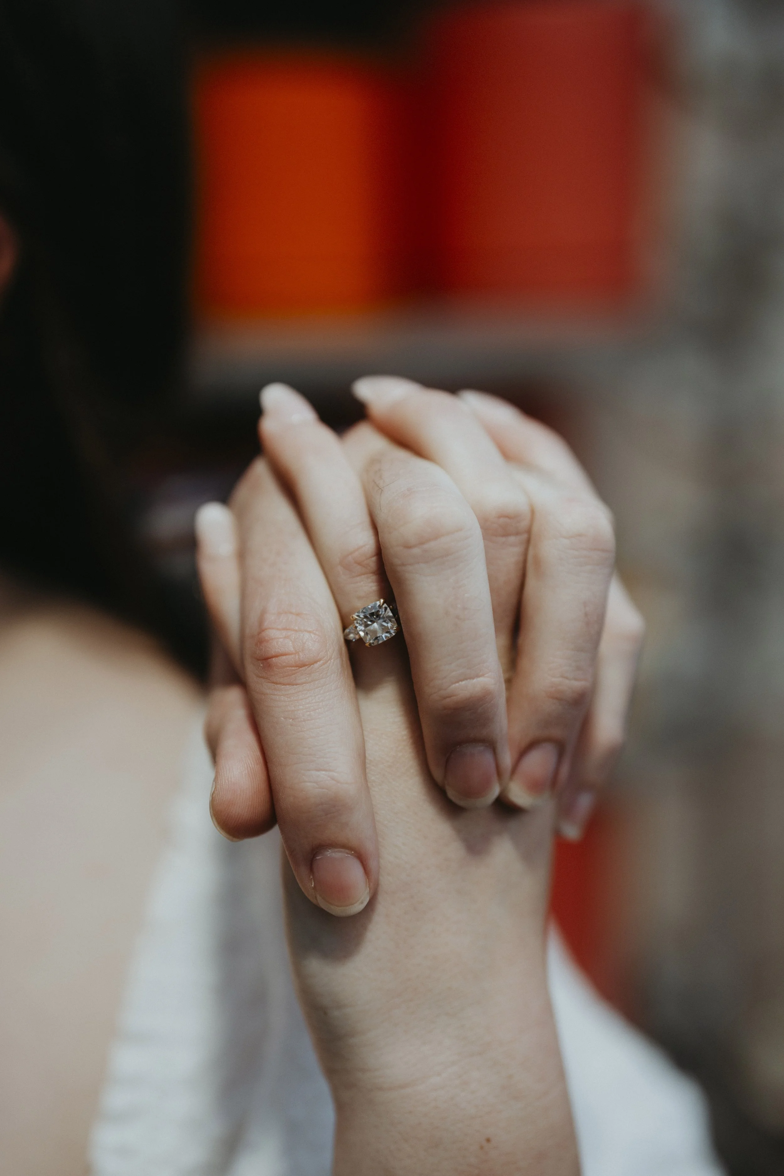 Engagement ring on holding hands