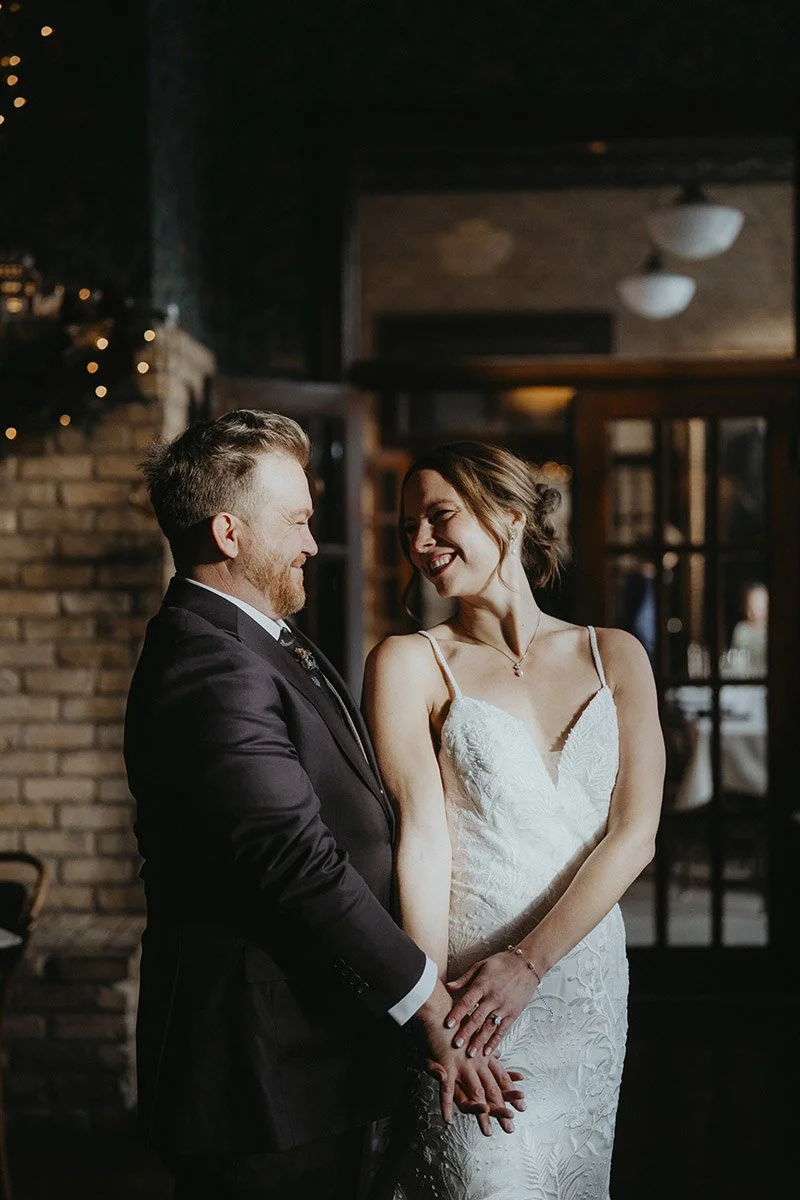 Candid moment between a couple at their winter wedding