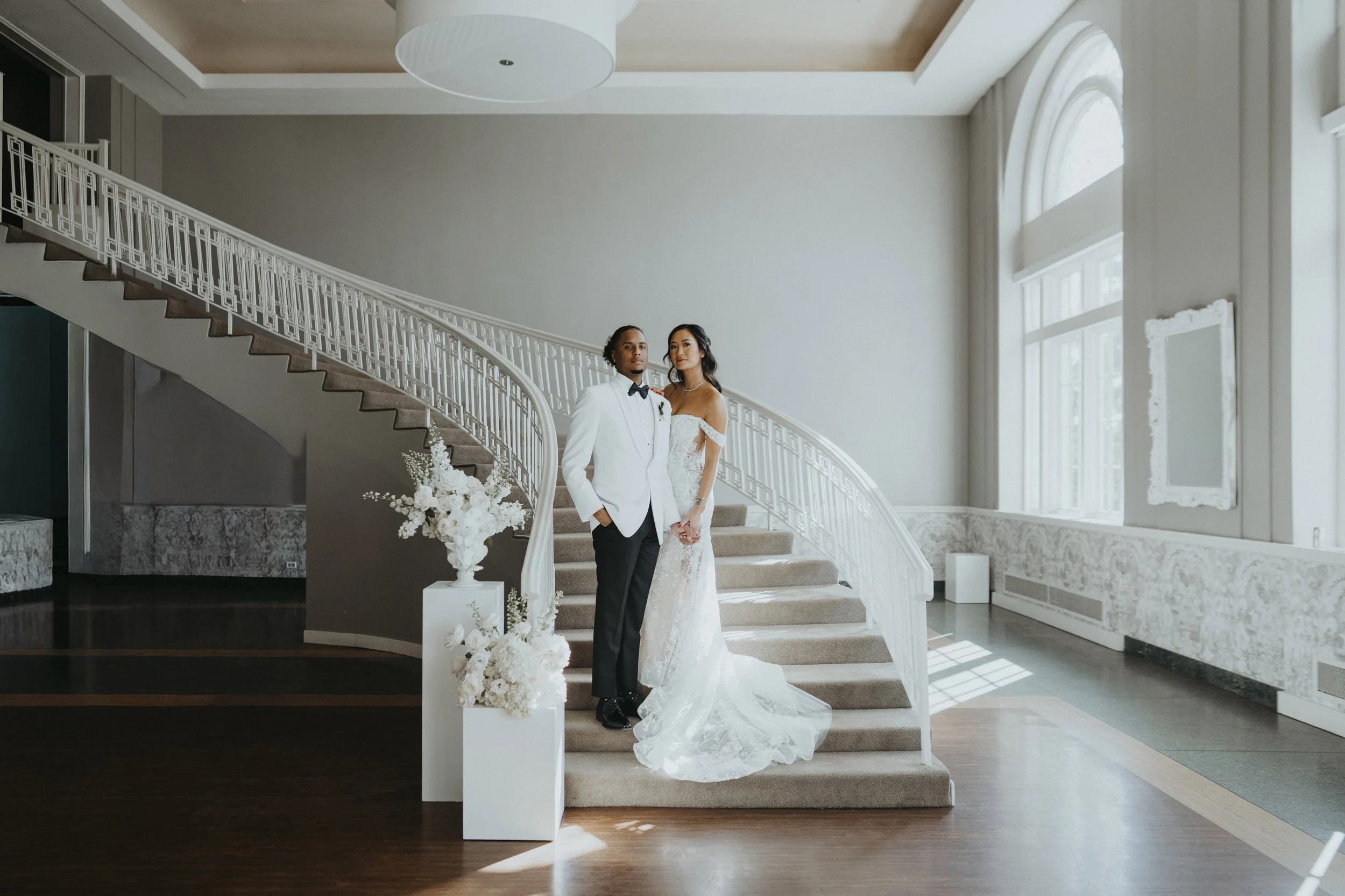 Elegant wedding day portraits on white stair case