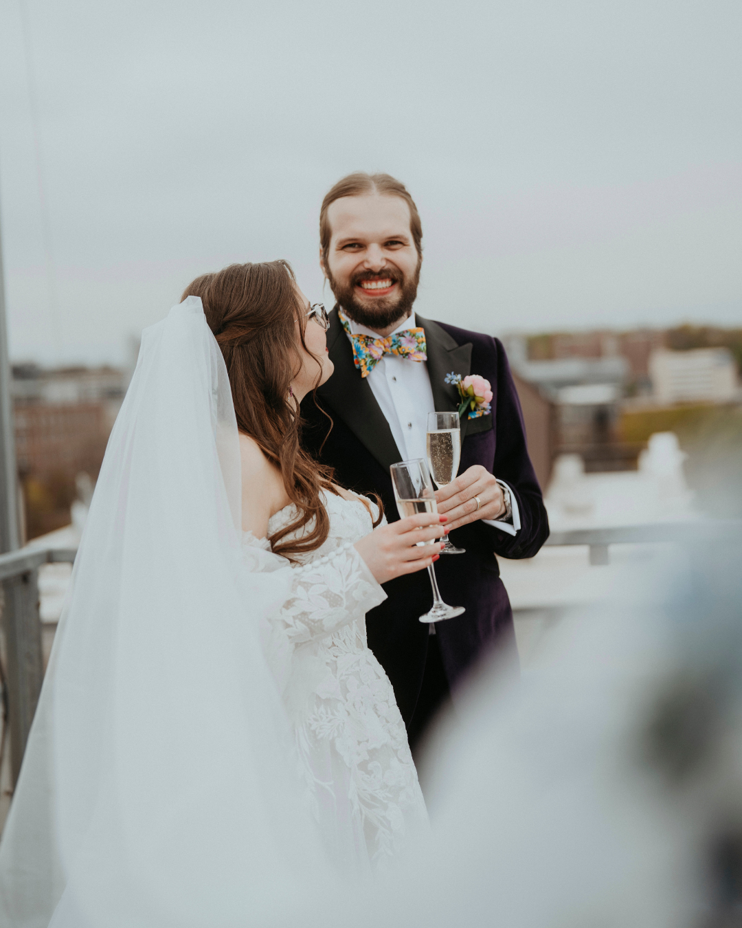 Bride and groom sipping champagne and celebrating during wedding reception