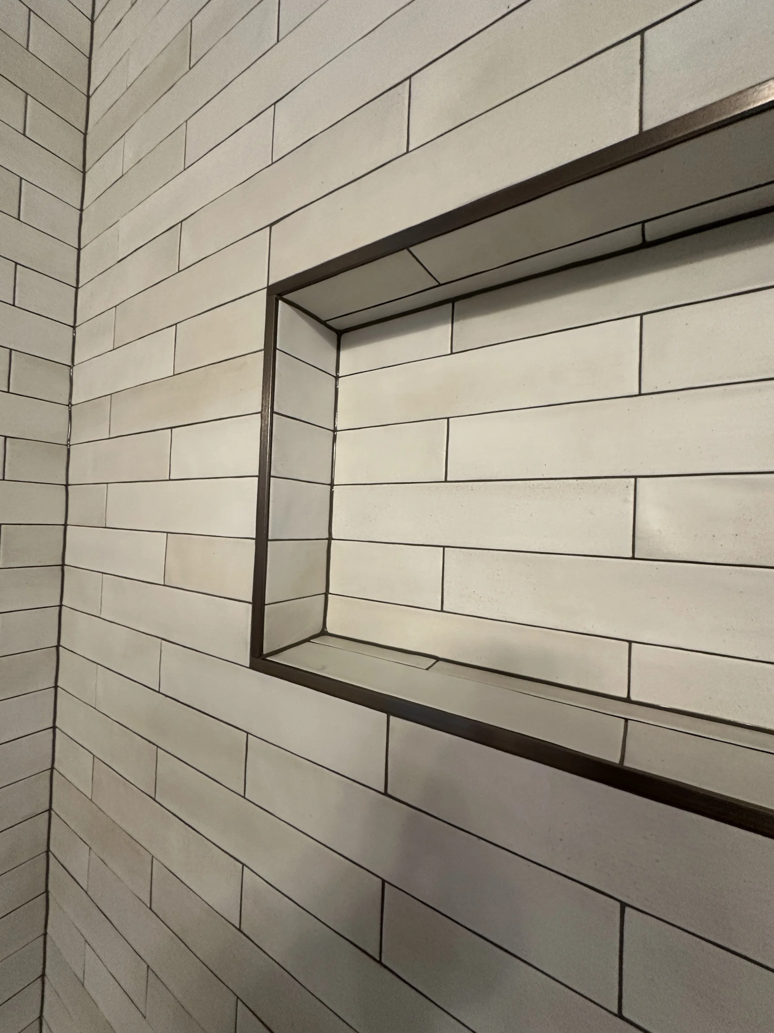 Outdated bathtub before tub to shower conversion in Mercer Island bathroom renovation