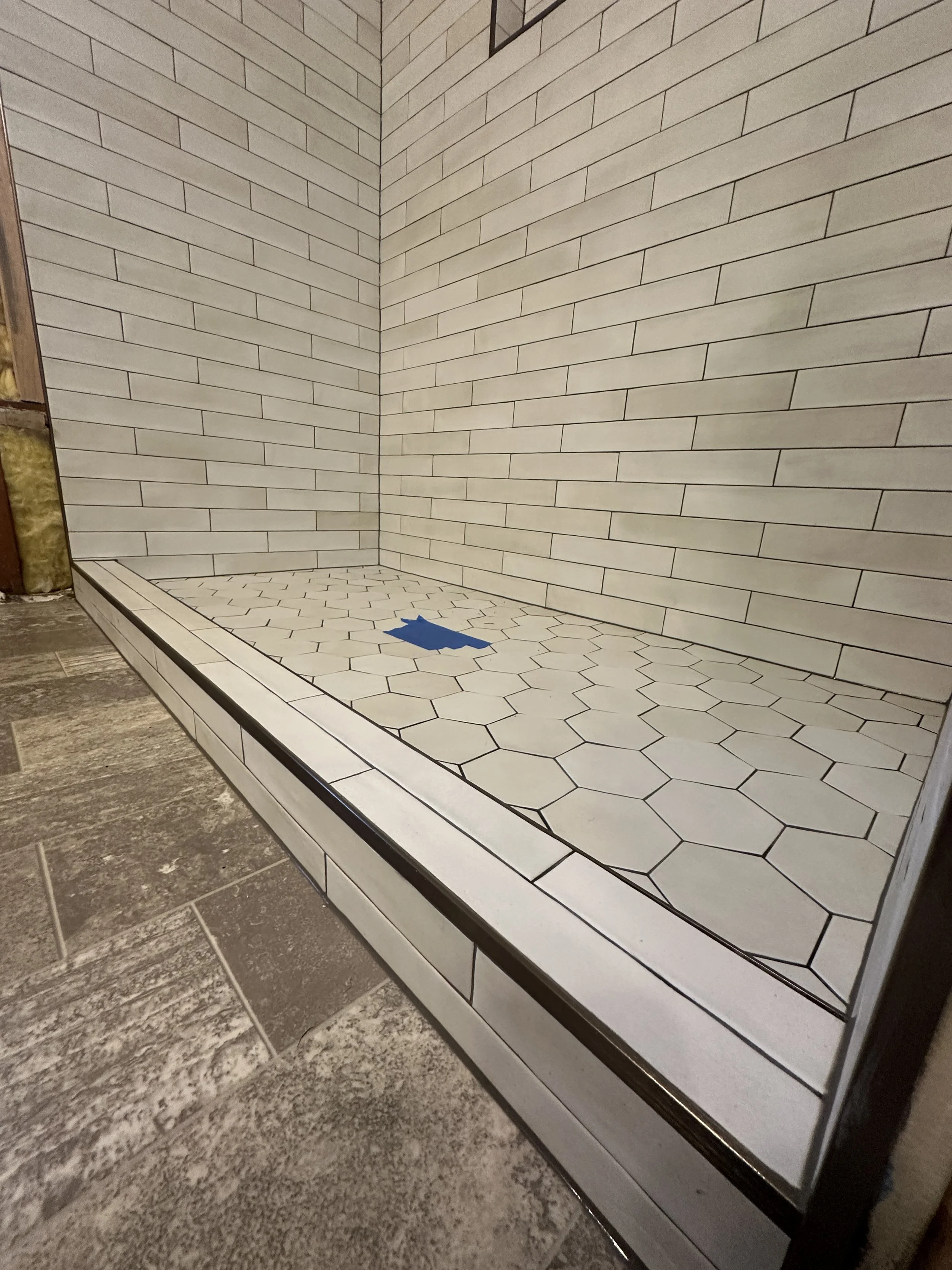 Outdated bathtub before tub to shower conversion in Mercer Island bathroom renovation