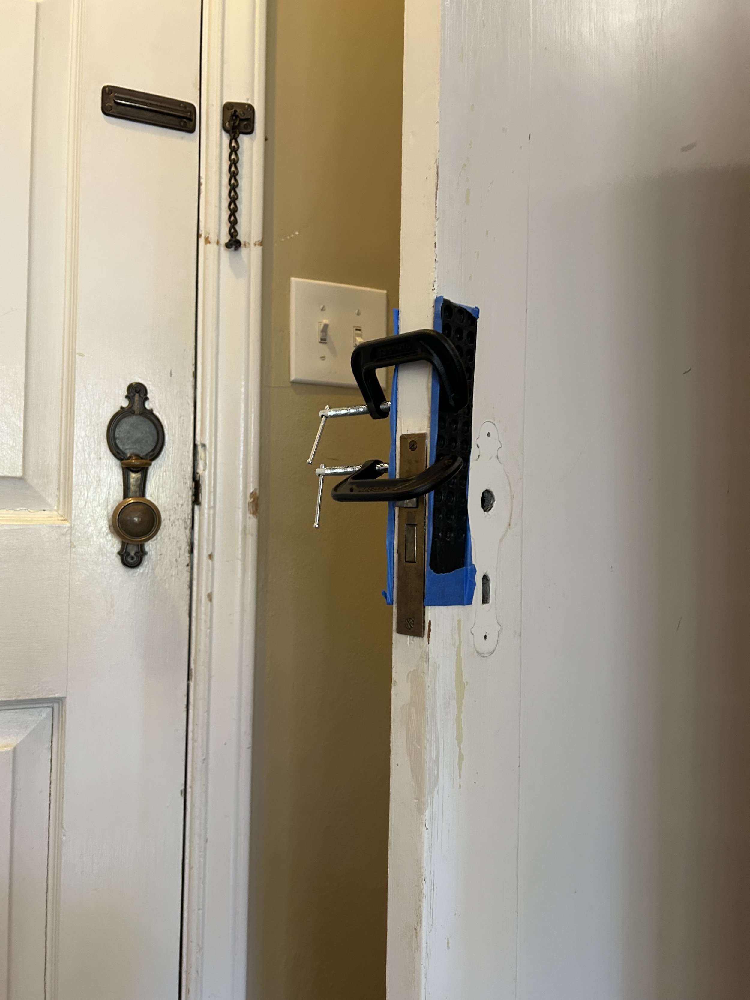 Expert handyman fixing vintage door hardware in Seattle