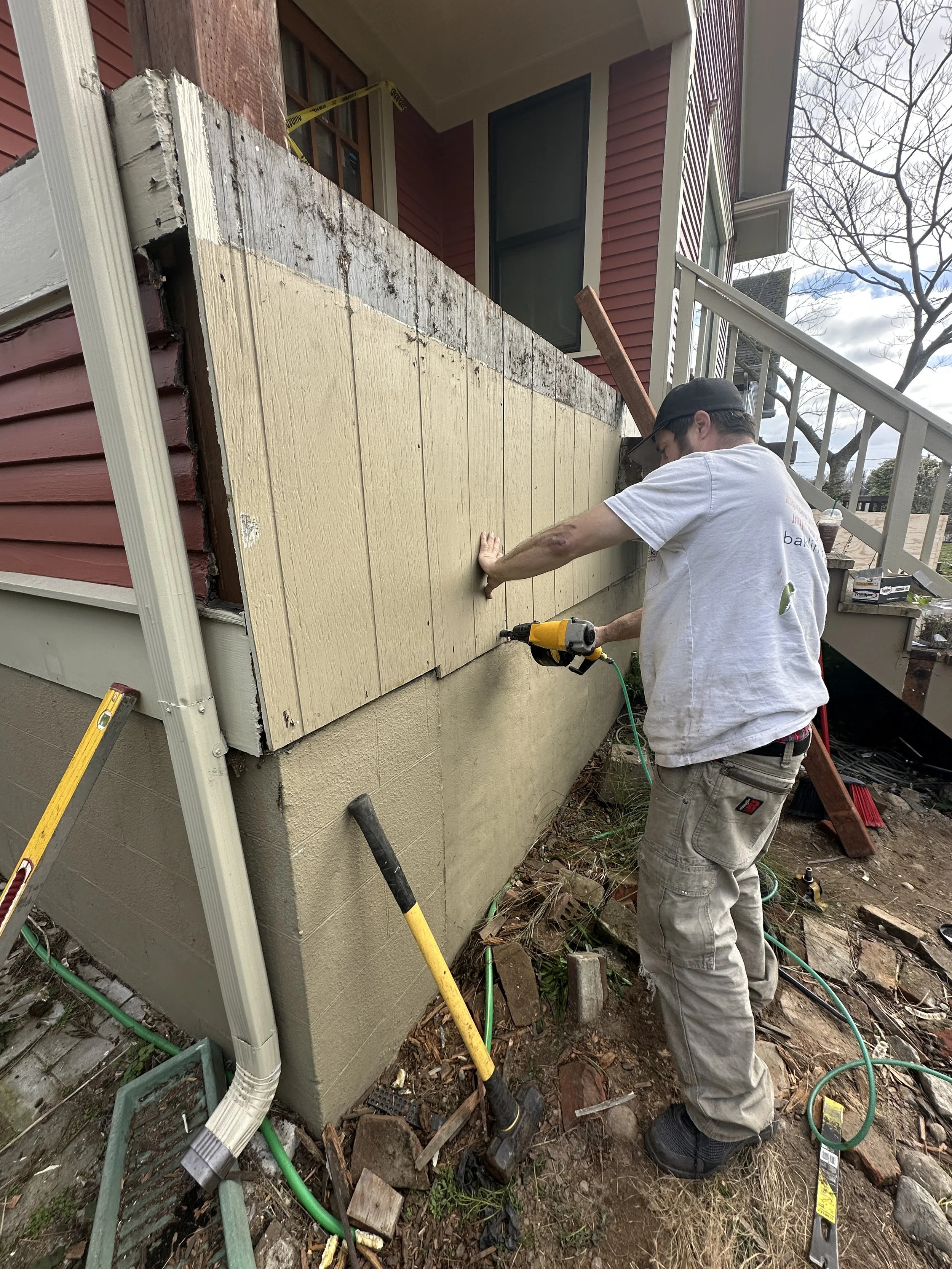 Deck reframing with new pressure-treated lumber Seattle deck repair project