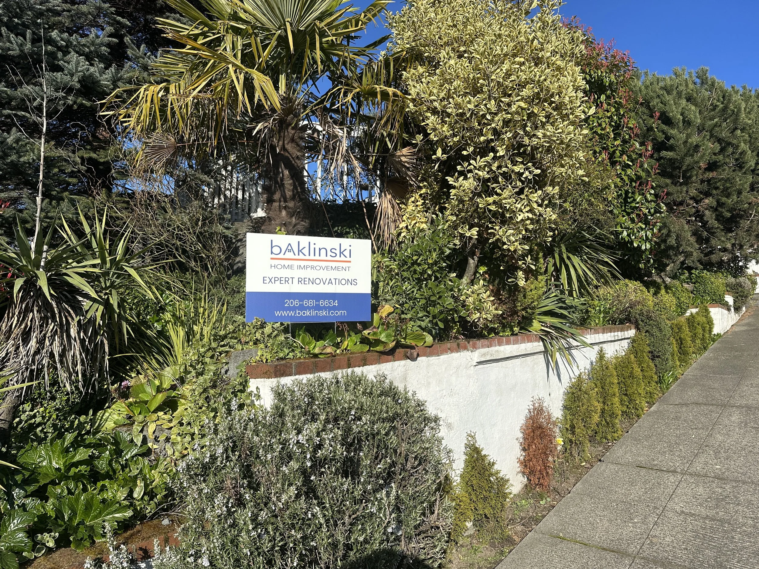 Baklinski Home Improvement yard sign in Seattle neighborhood after successful handyman project