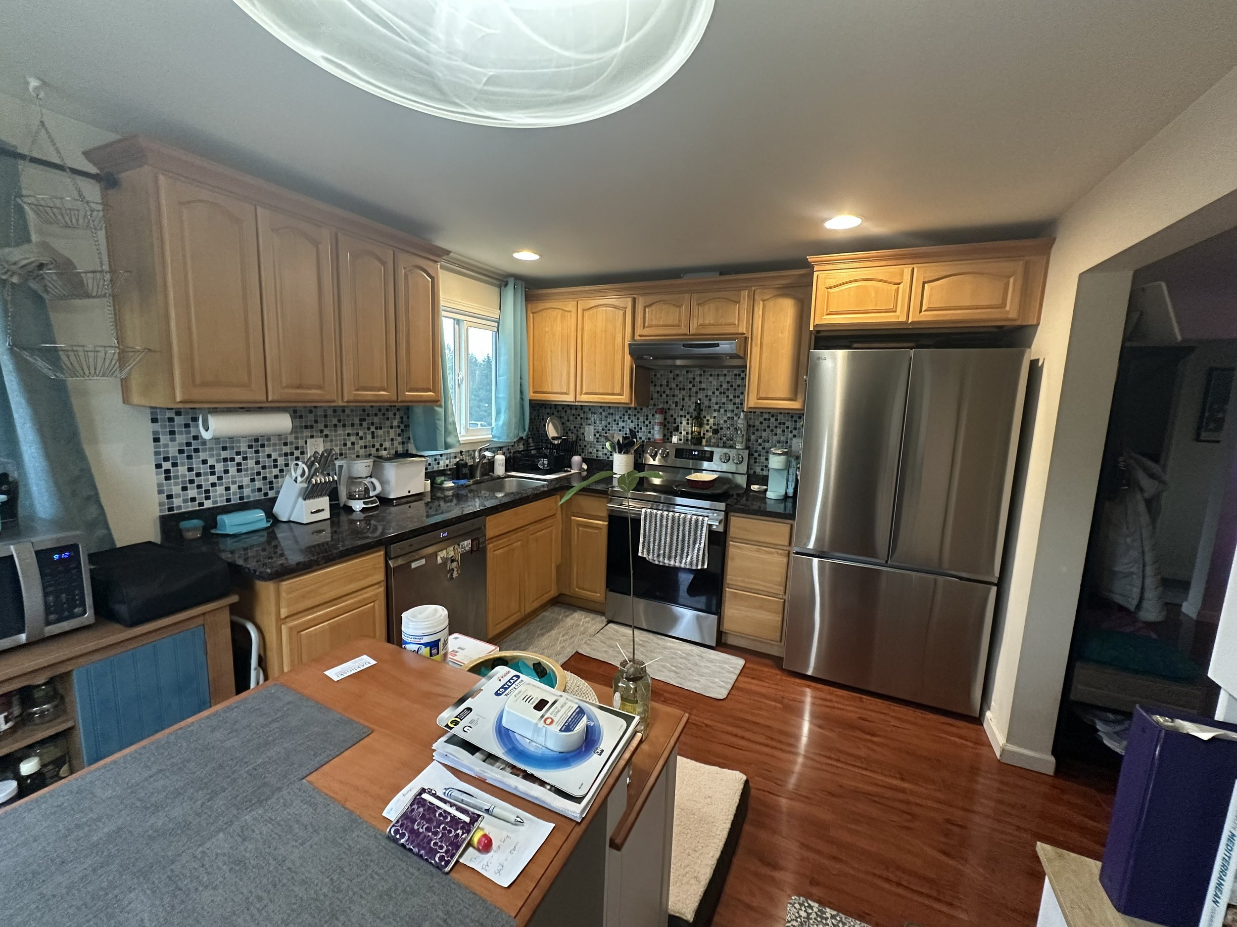 Seattle kitchen remodel before – Christine’s dated kitchen with island in Seattle WA