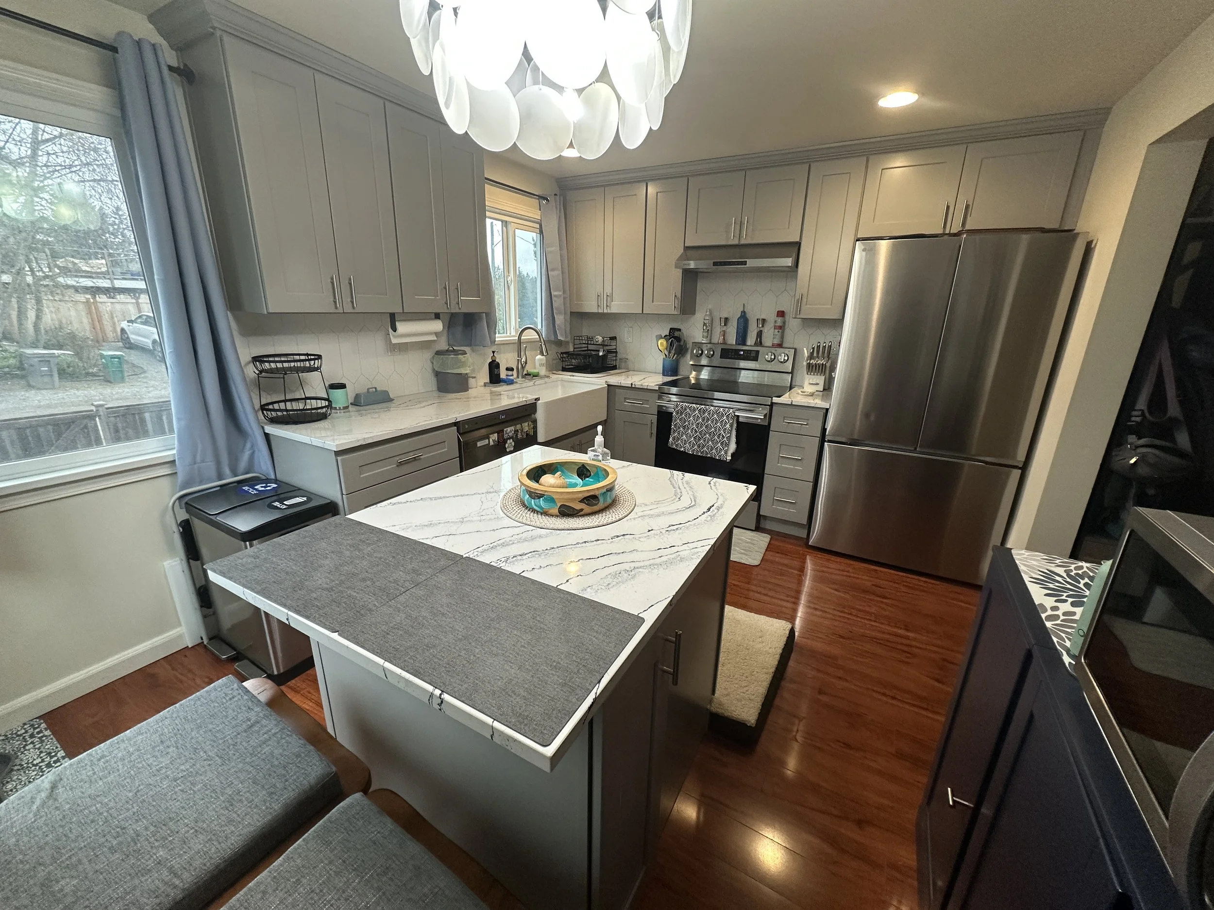 Seattle kitchen remodel after – bright airy kitchen with farmhouse sink in Seattle WA