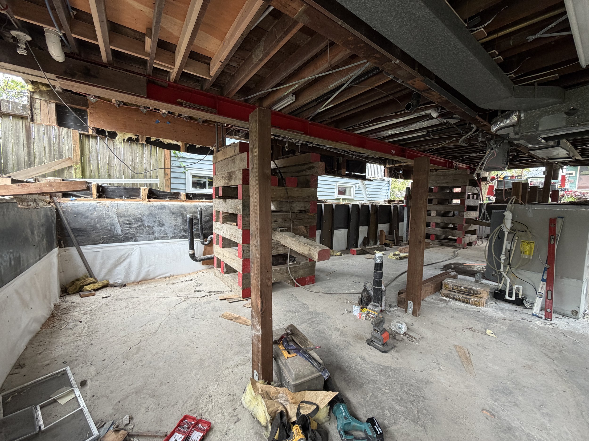 House lifted 2 feet with cribbing and supports