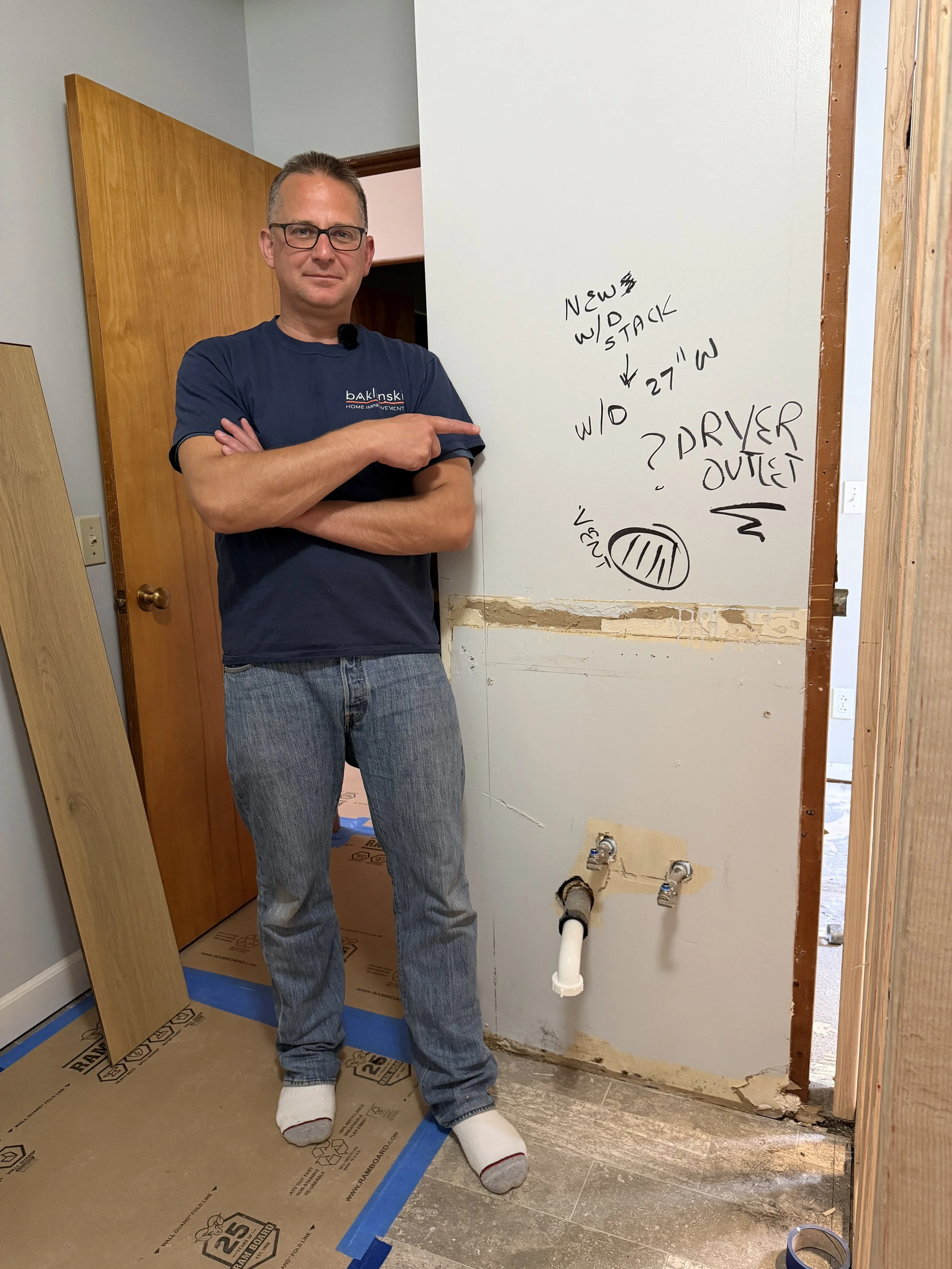 Before/after photo of dryer vent area turned into stylish shower