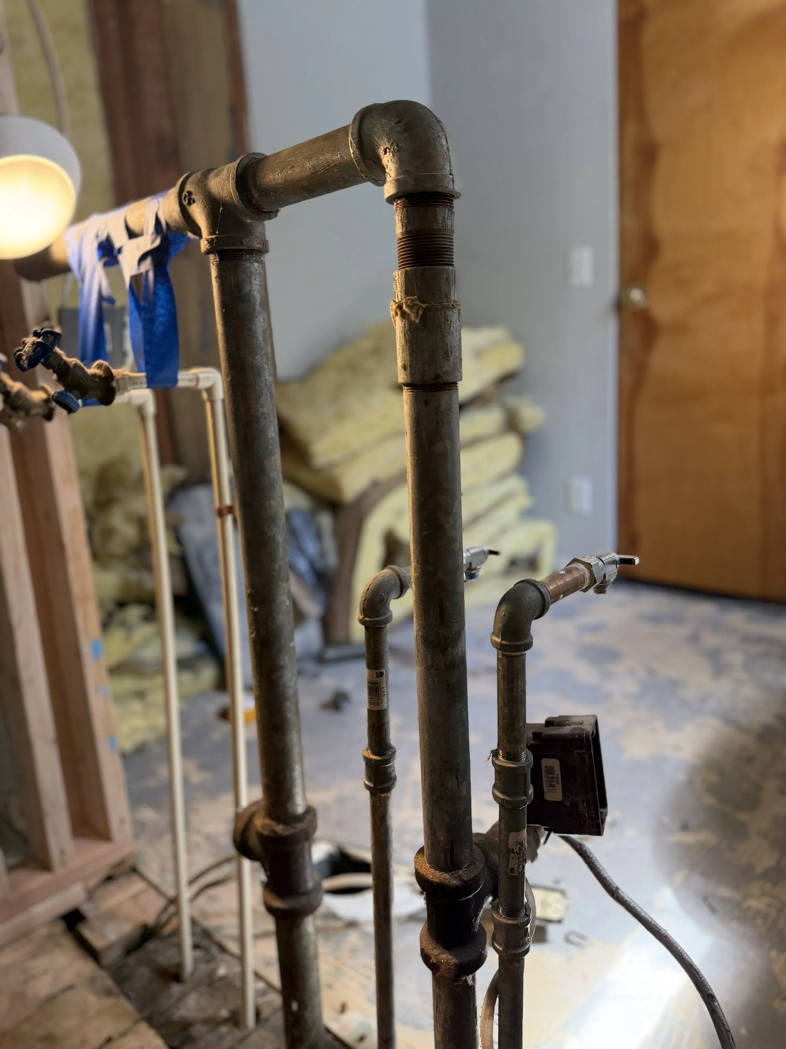 Replacing old galvanized piping with new PEX plumbing during Seattle area kitchen bathroom remodel