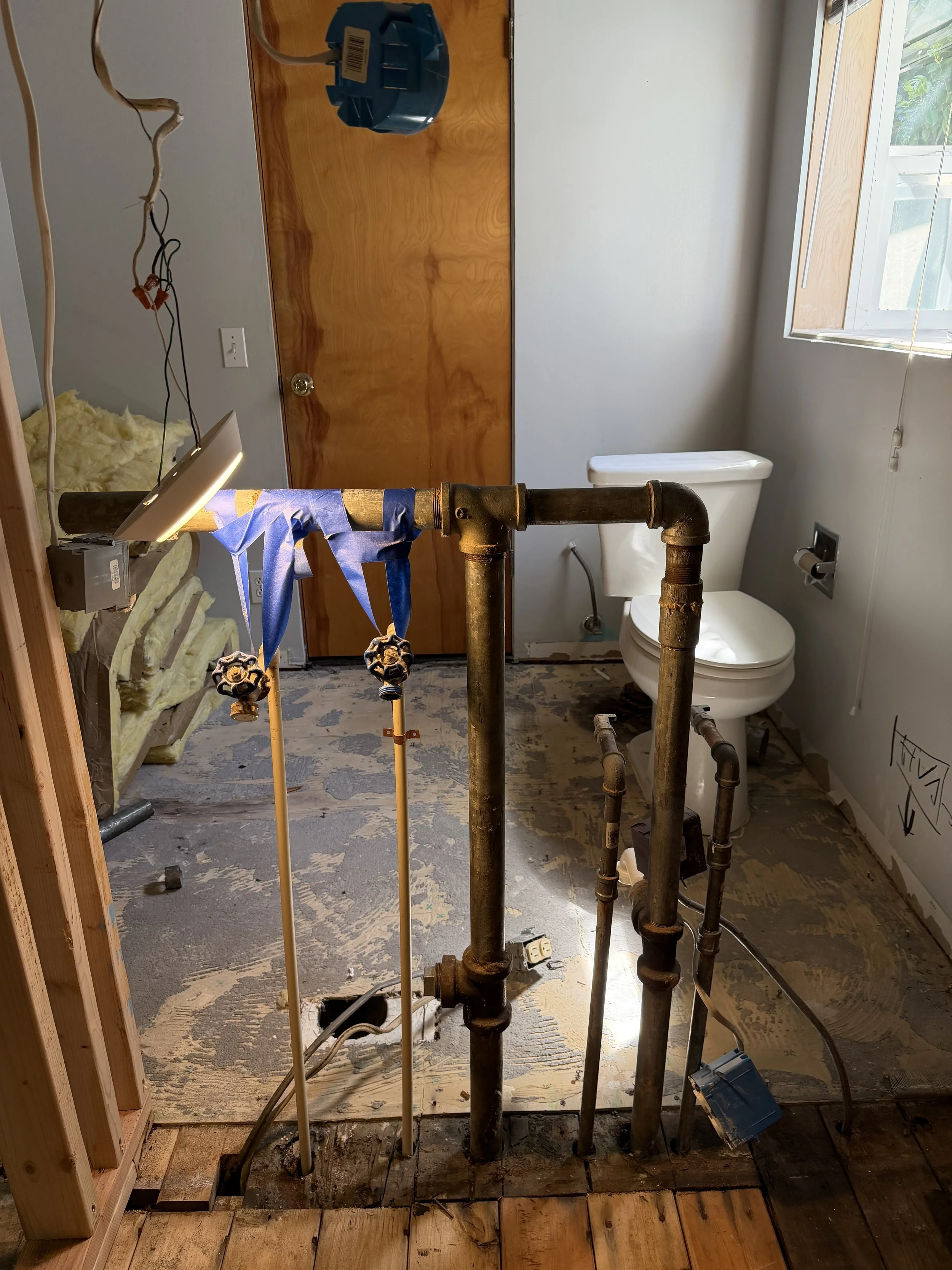 Replacing old galvanized piping with new PEX plumbing during Seattle area kitchen bathroom remodel