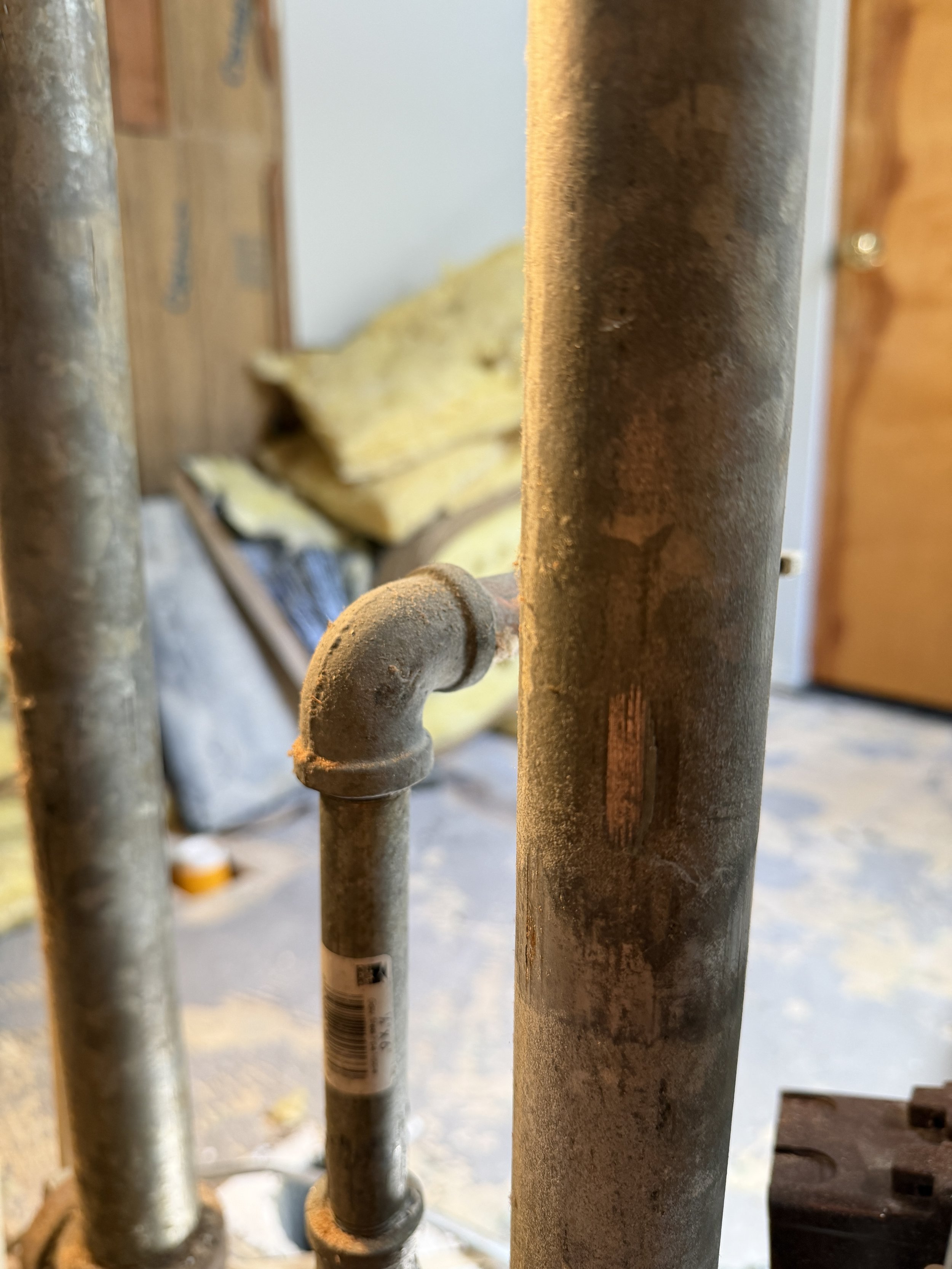 Replacing old galvanized piping with new PEX plumbing during Seattle area kitchen bathroom remodel