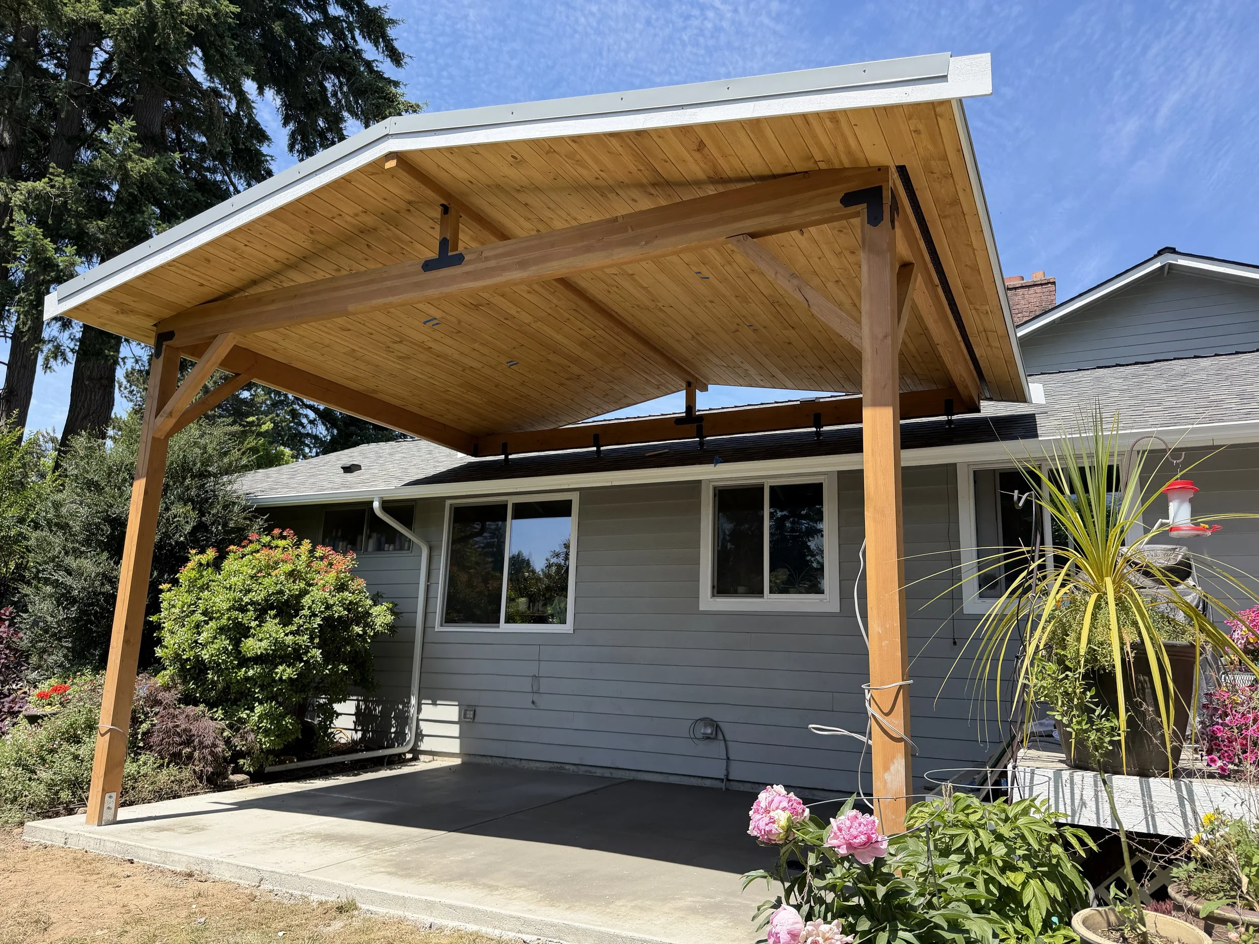 Beautiful new custom wood frame awning installed on a Bellevue, WA deck by Baklinski Home Improvement