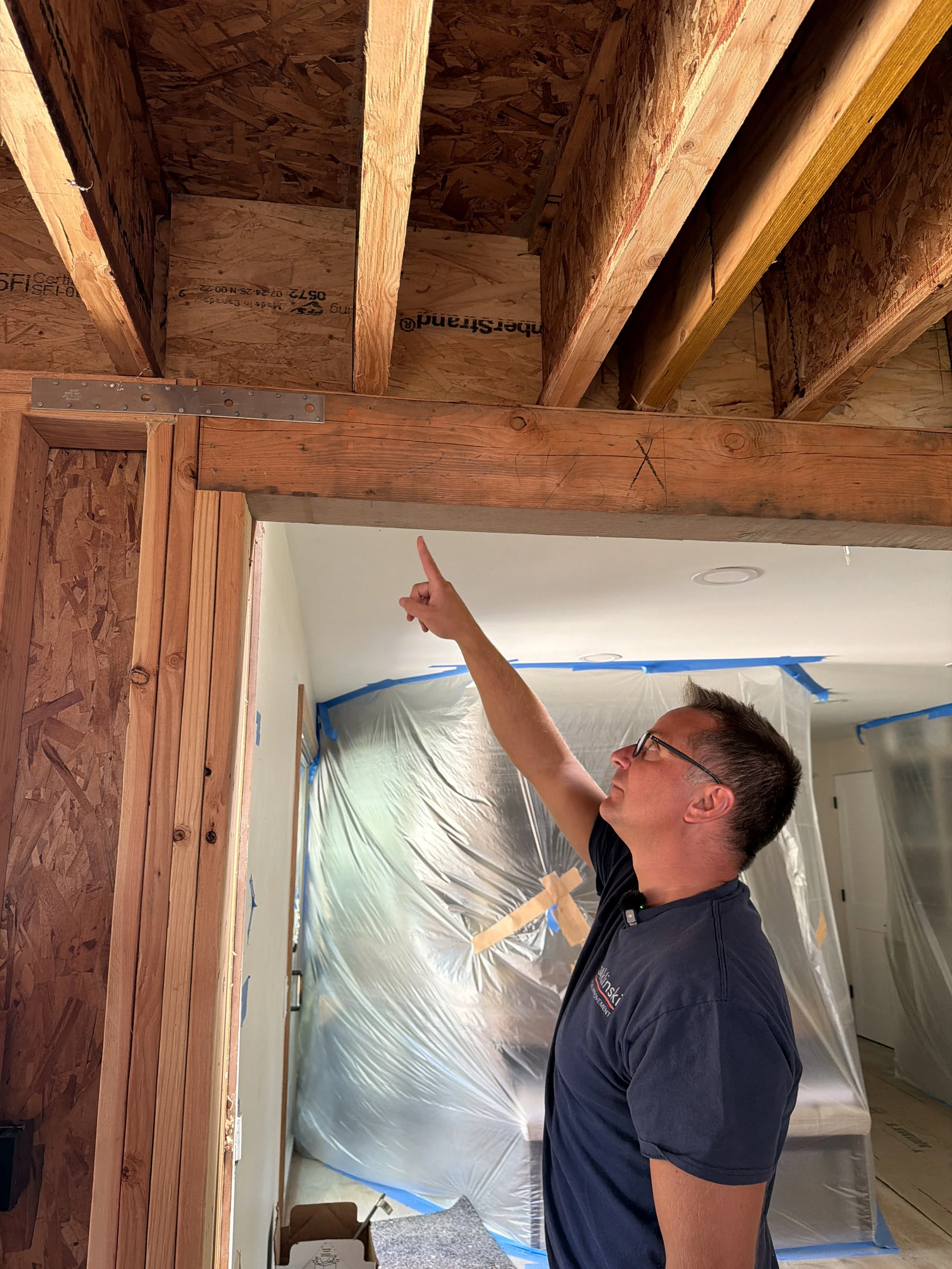 Baklinski Home Improvement team inspecting residential framing and load bearing walls in Seattle area