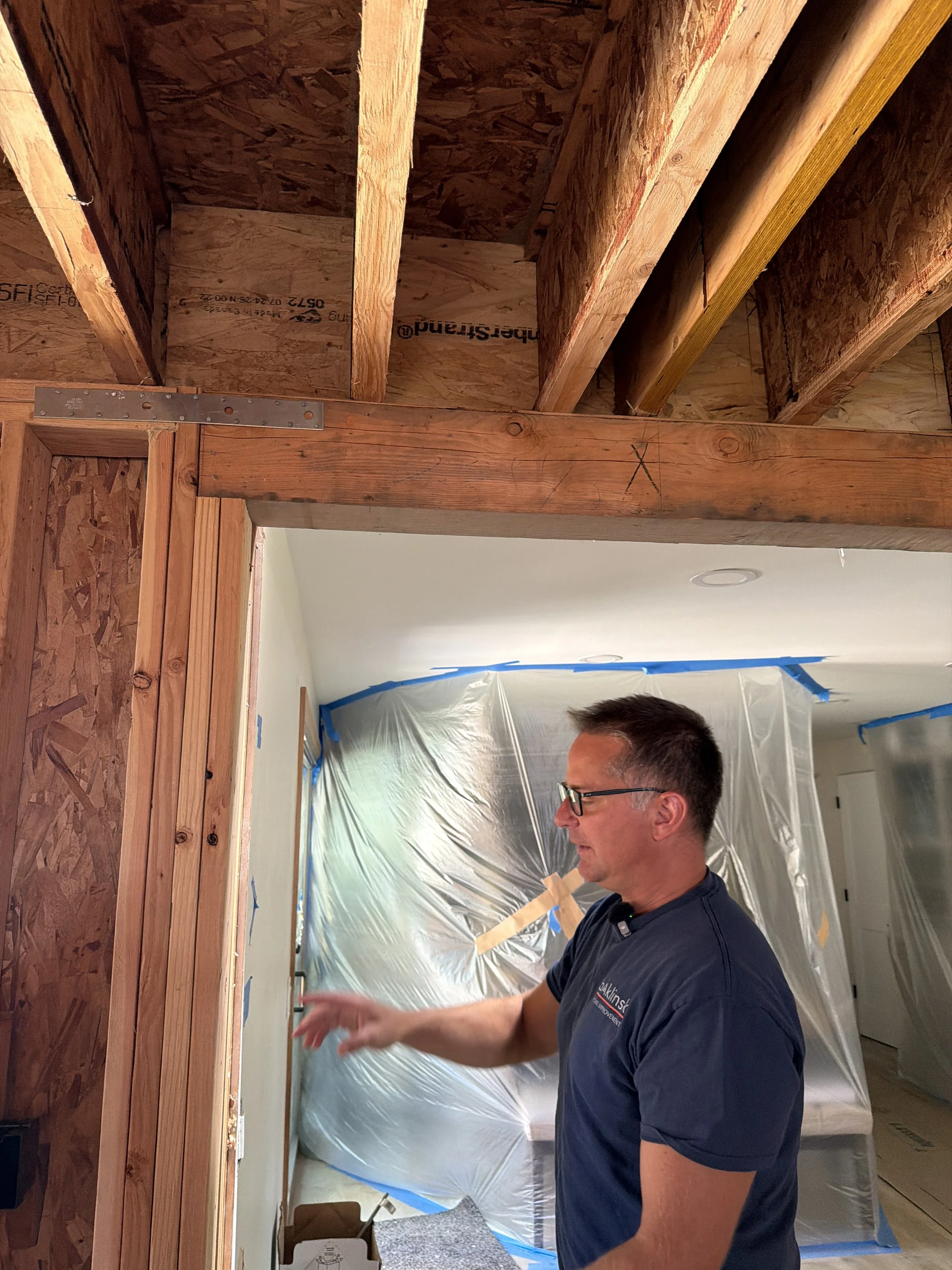 6x beam and column supporting floor joists in load bearing framing Seattle remodel