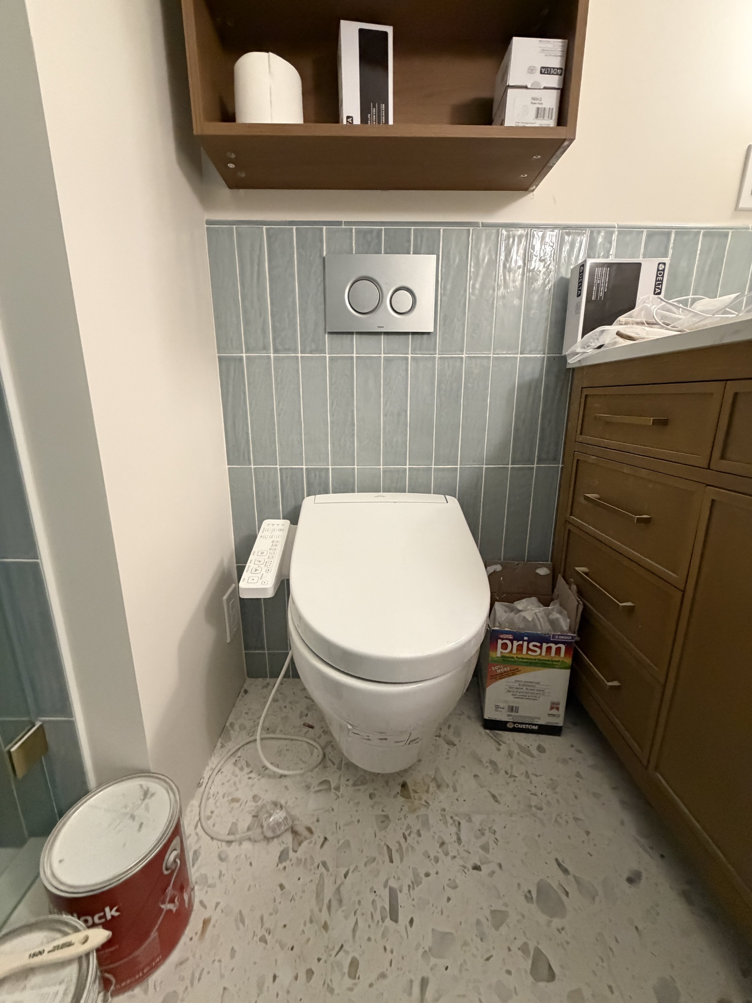 Open glass shower and pocket door in small bathroom remodel Seattle area by Baklinski Home Improvement