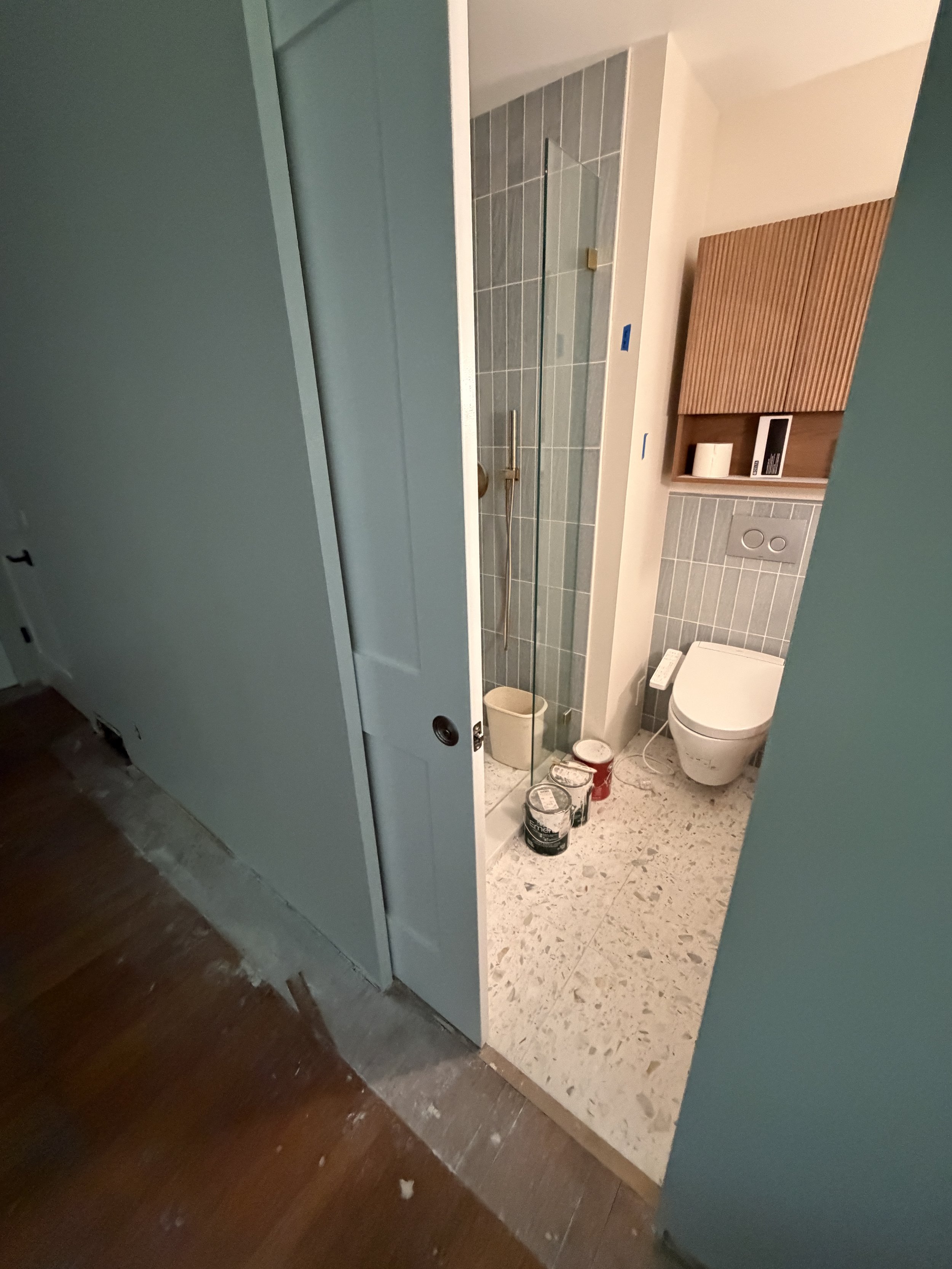 Open glass shower and pocket door in small bathroom remodel Seattle area by Baklinski Home Improvement