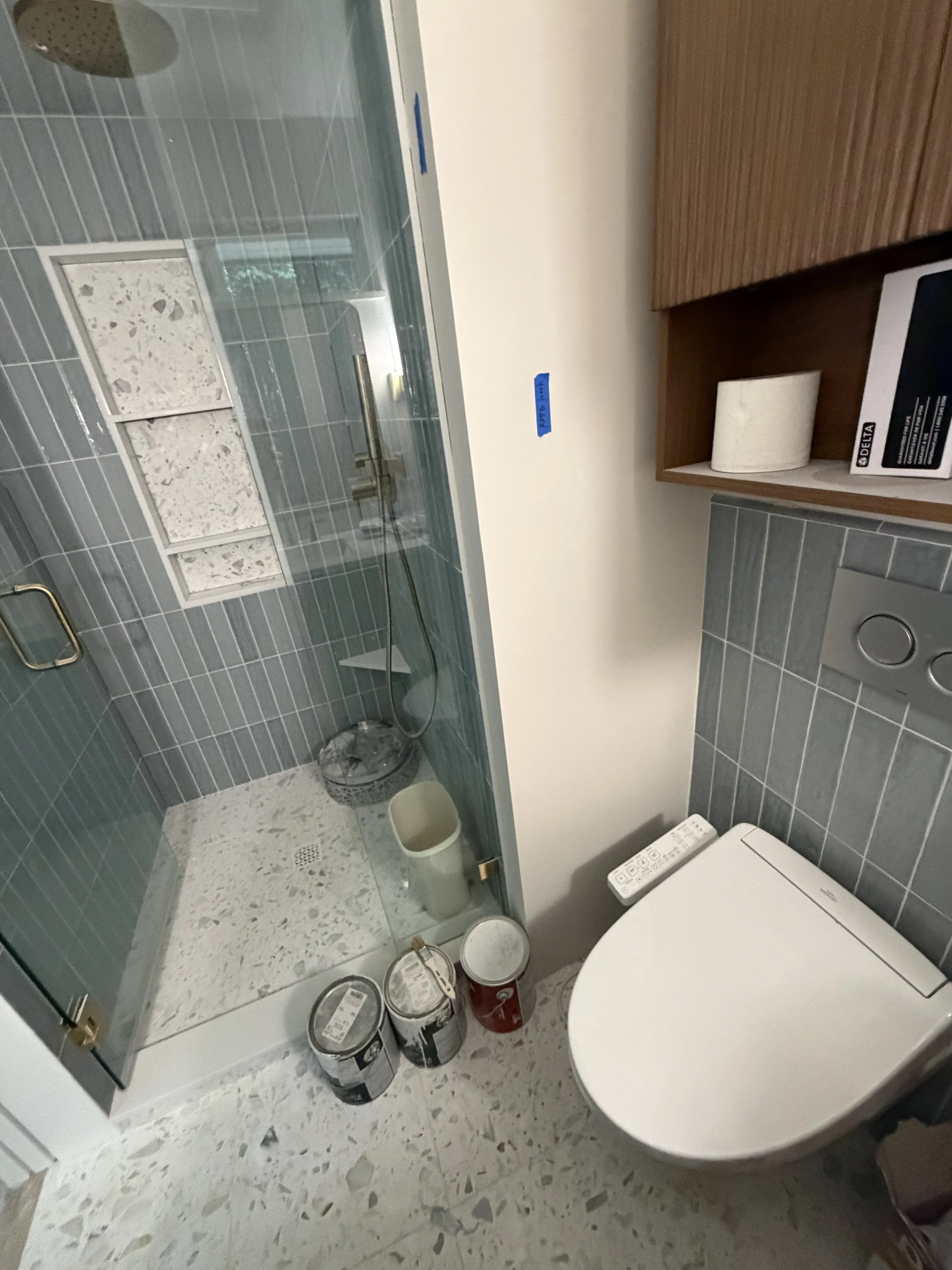 Open glass shower and pocket door in small bathroom remodel Seattle area by Baklinski Home Improvement