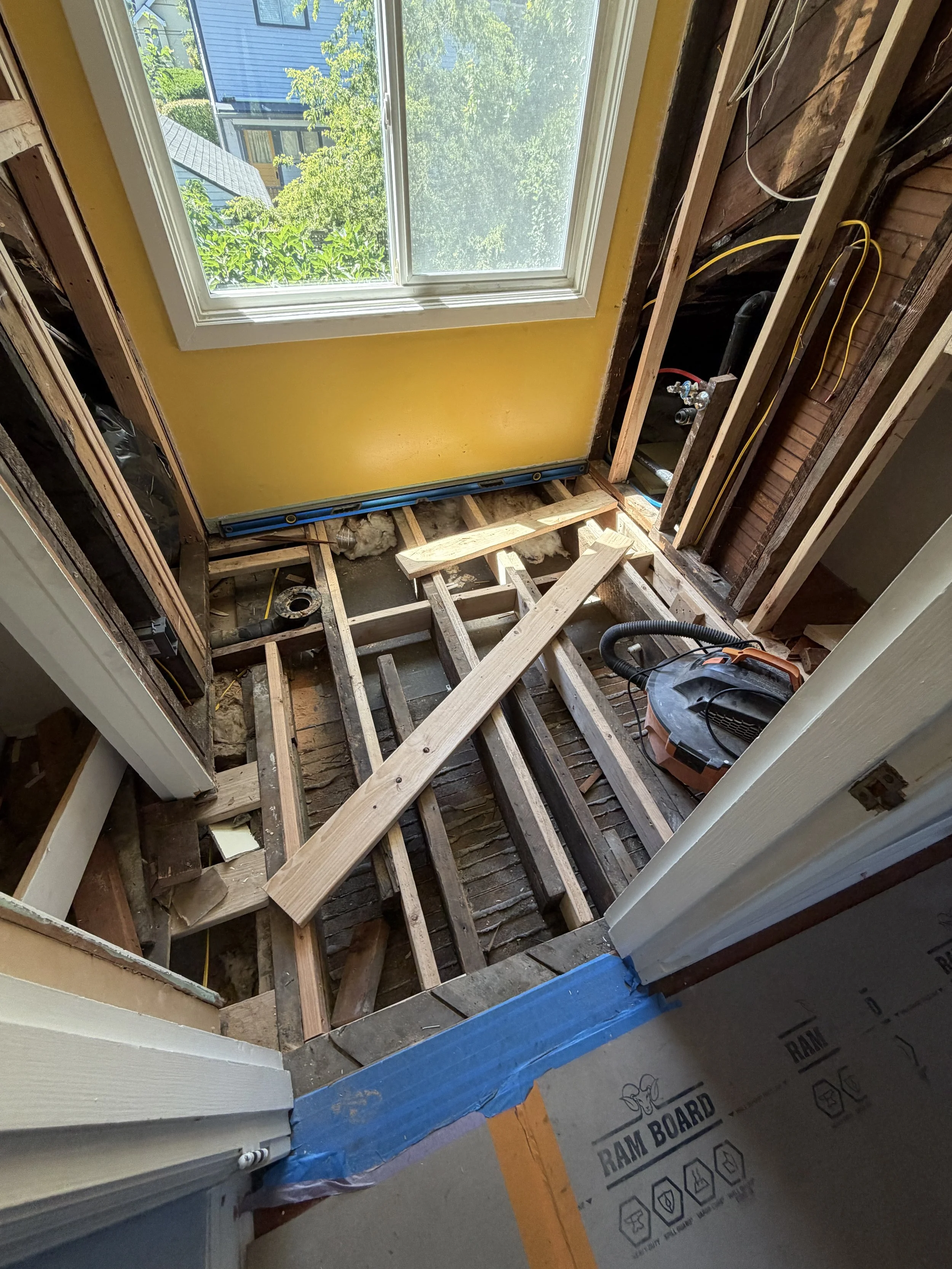 seattle-small-bathroom-remodel-floor-ripped-up-piping.jpg
